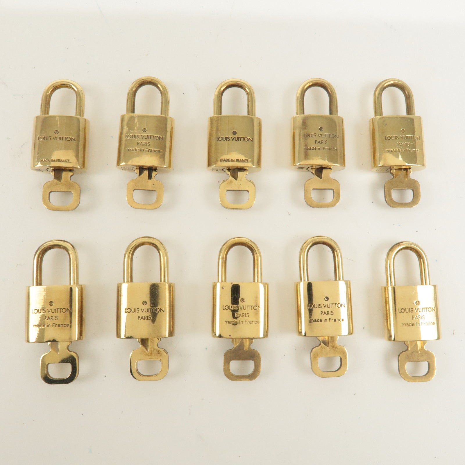 Louis Vuitton Set of 10 Lock 
Key Cadena Key Lock Gold