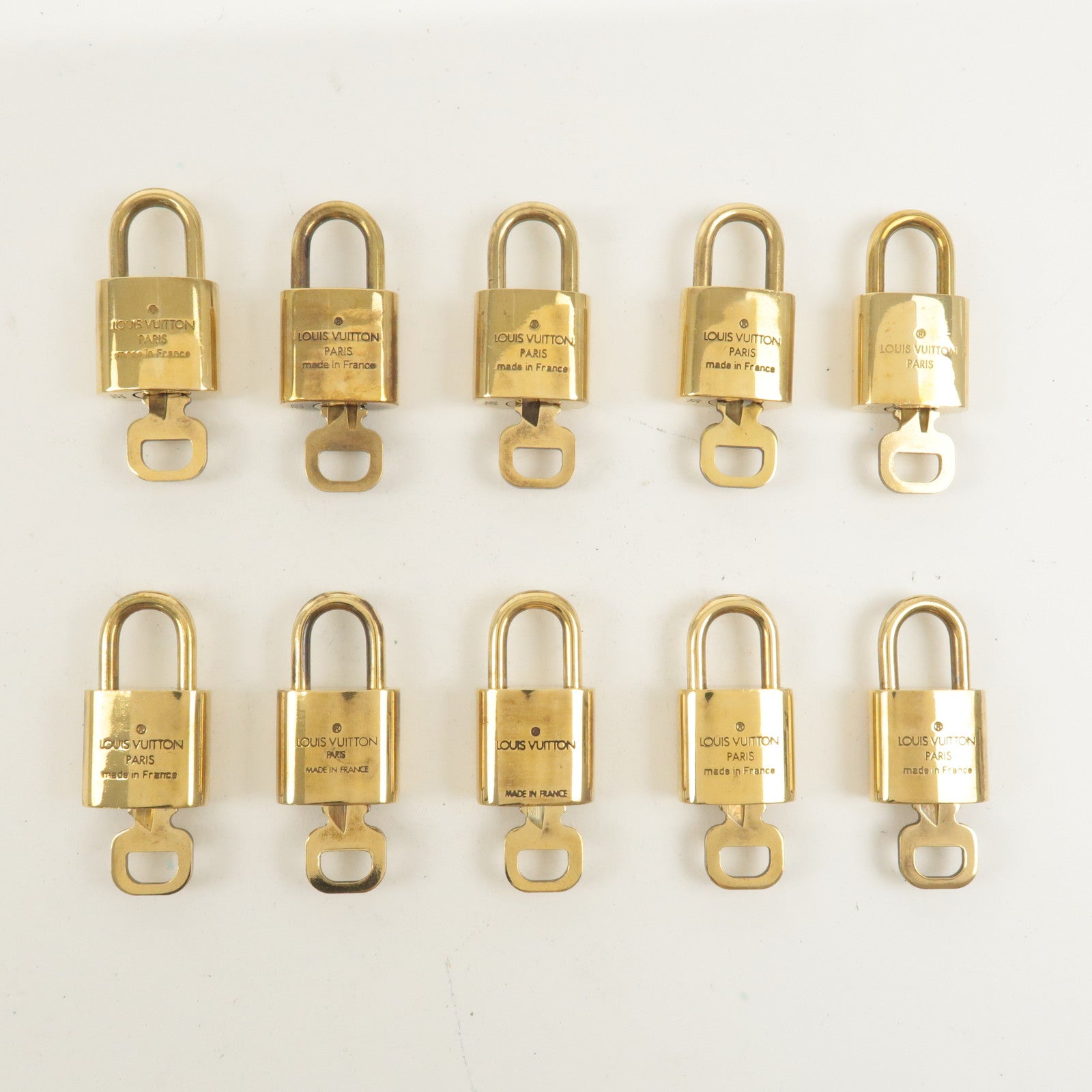 Louis Vuitton Set of 10 Lock 
Key Cadena Key Lock Gold