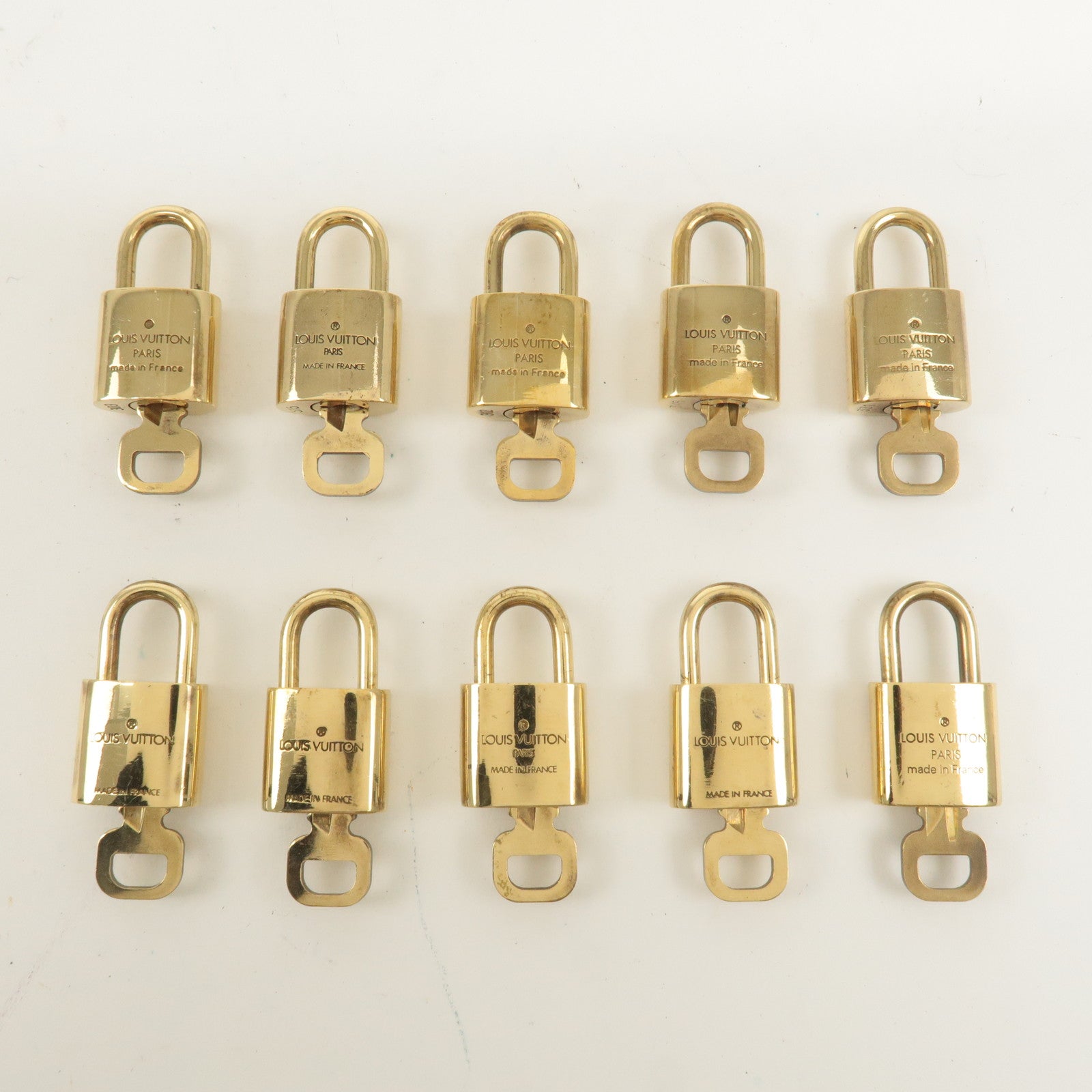 Louis Vuitton Set of 10 Lock 
Key Cadena Key Lock Gold