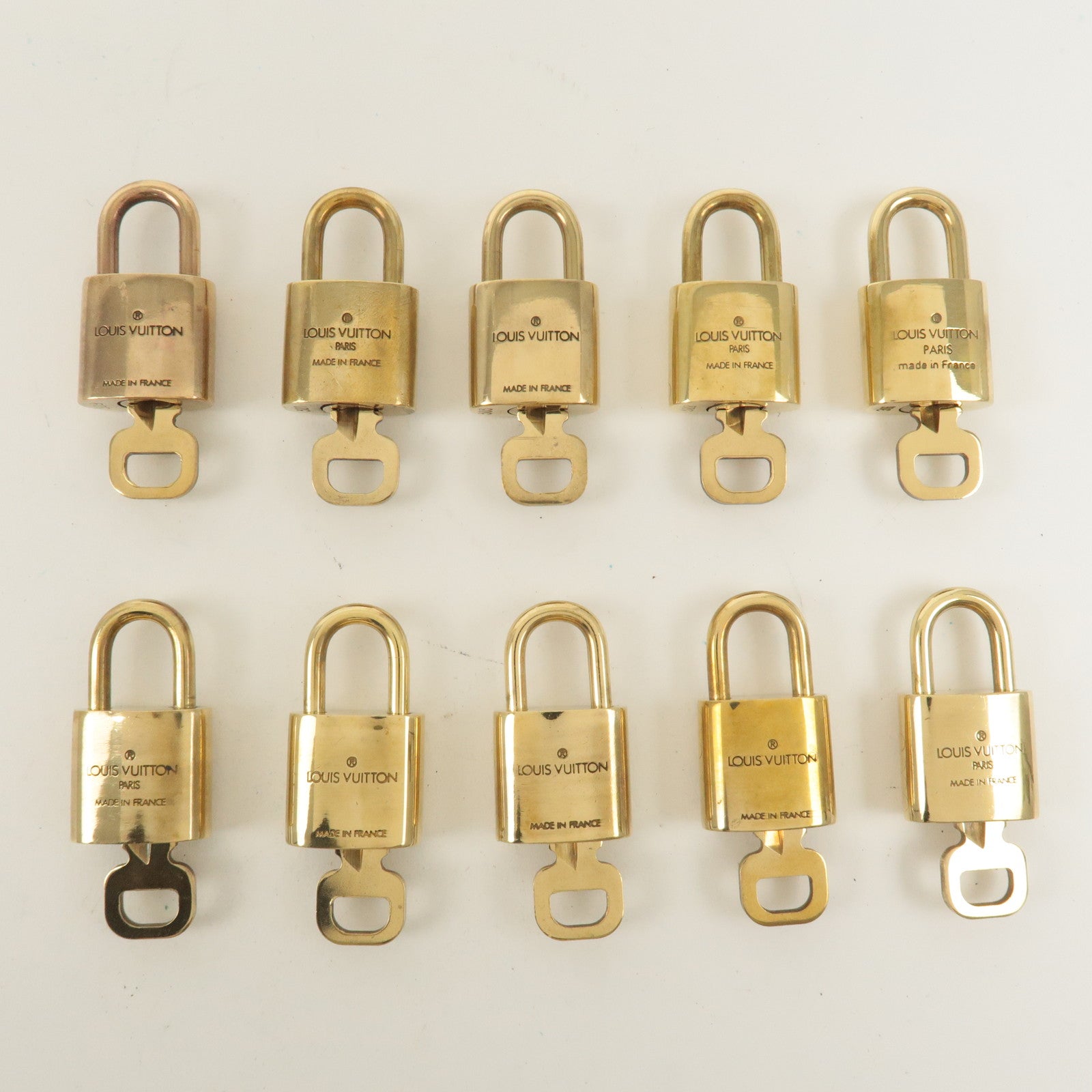 Louis Vuitton Set of 10 Lock 
Key Cadena Key Lock Gold