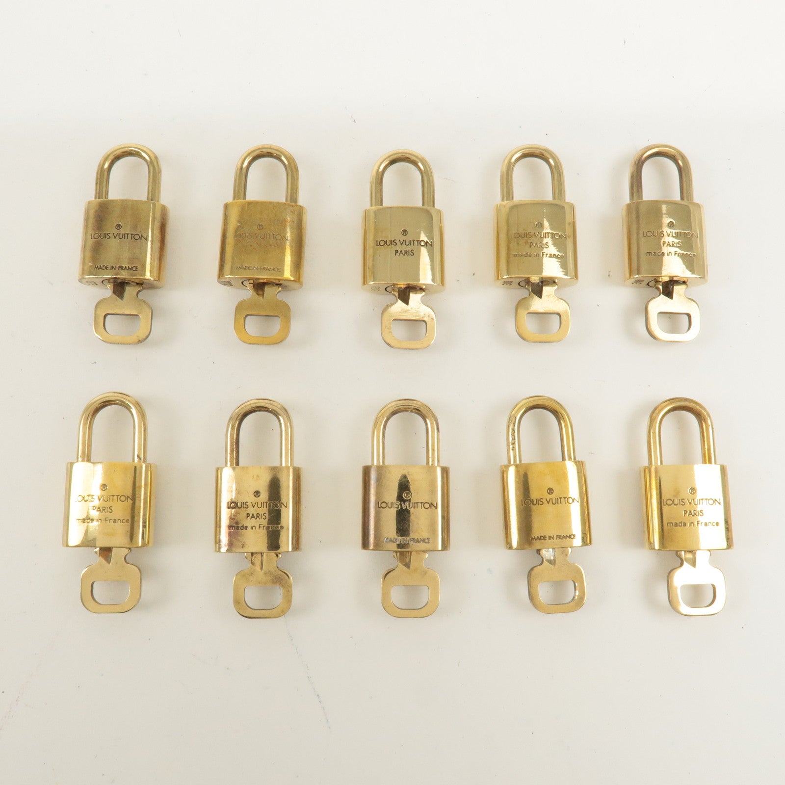 Louis Vuitton Set of 10 Lock 
Key Cadena Key Lock Gold