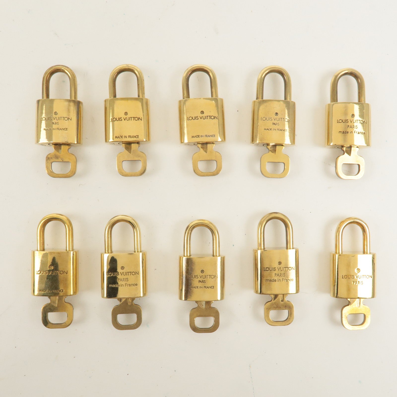 Louis Vuitton Set of 10 Lock 
Key Cadena Key Lock Gold