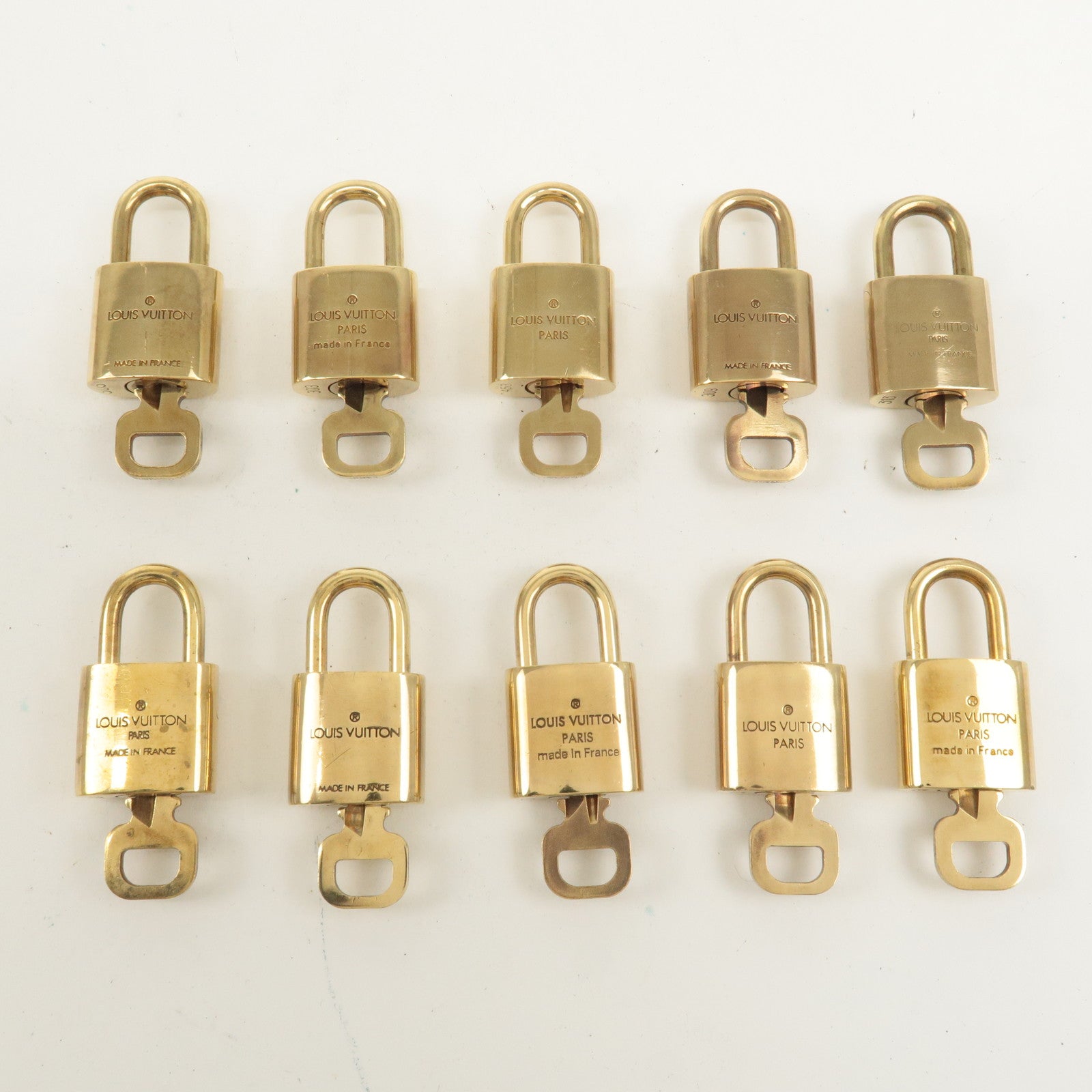 Louis Vuitton Set of 10 Lock 
Key Cadena Key Lock Gold