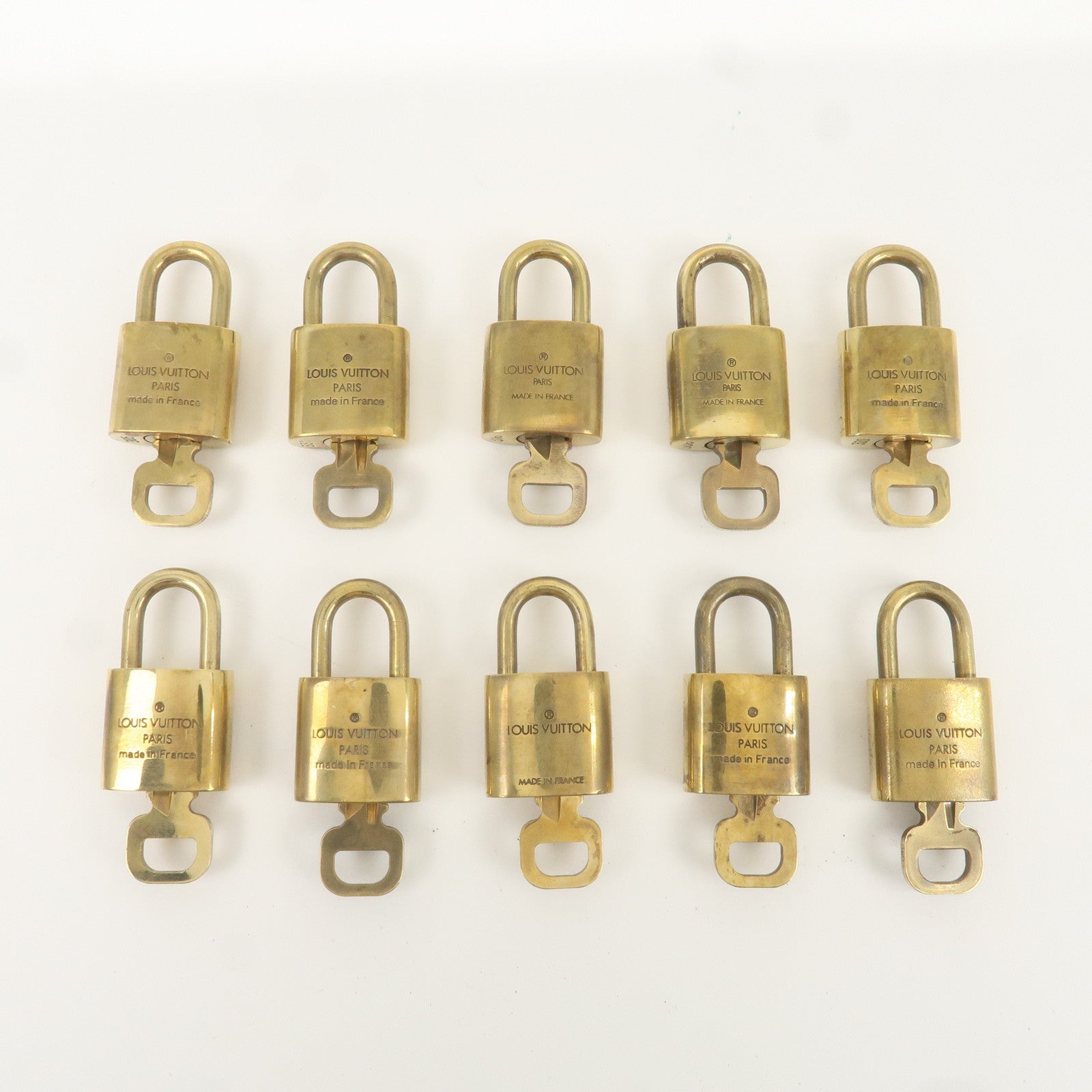 Louis Vuitton Set of 10 Lock 
Key Cadena Key Lock Gold