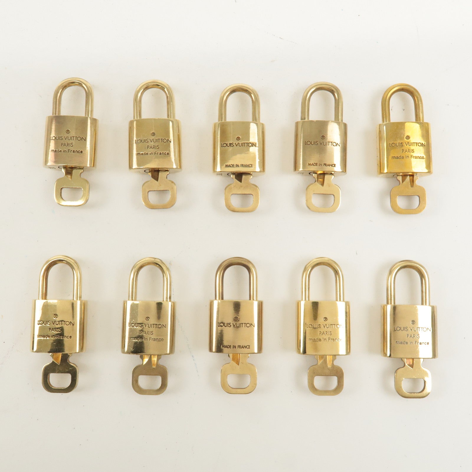 Louis Vuitton Set of 10 Lock 
Key Cadena Key Lock Gold