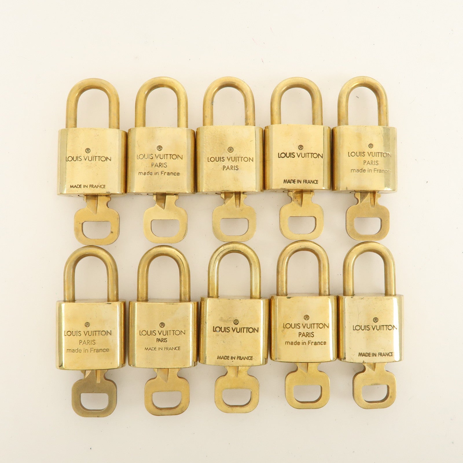 Louis Vuitton Set of 10 Lock 
Key Cadena Key Lock Used