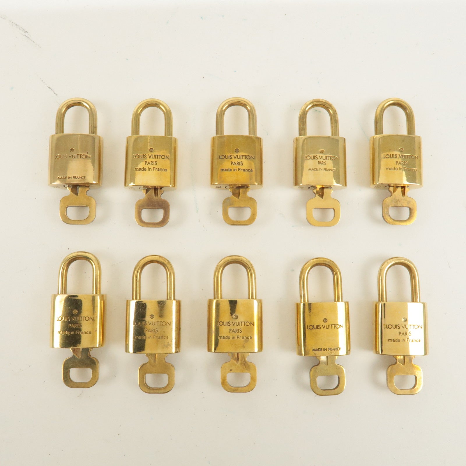 Louis Vuitton Set of 10 Lock 
Key Cadena Key Lock Gold