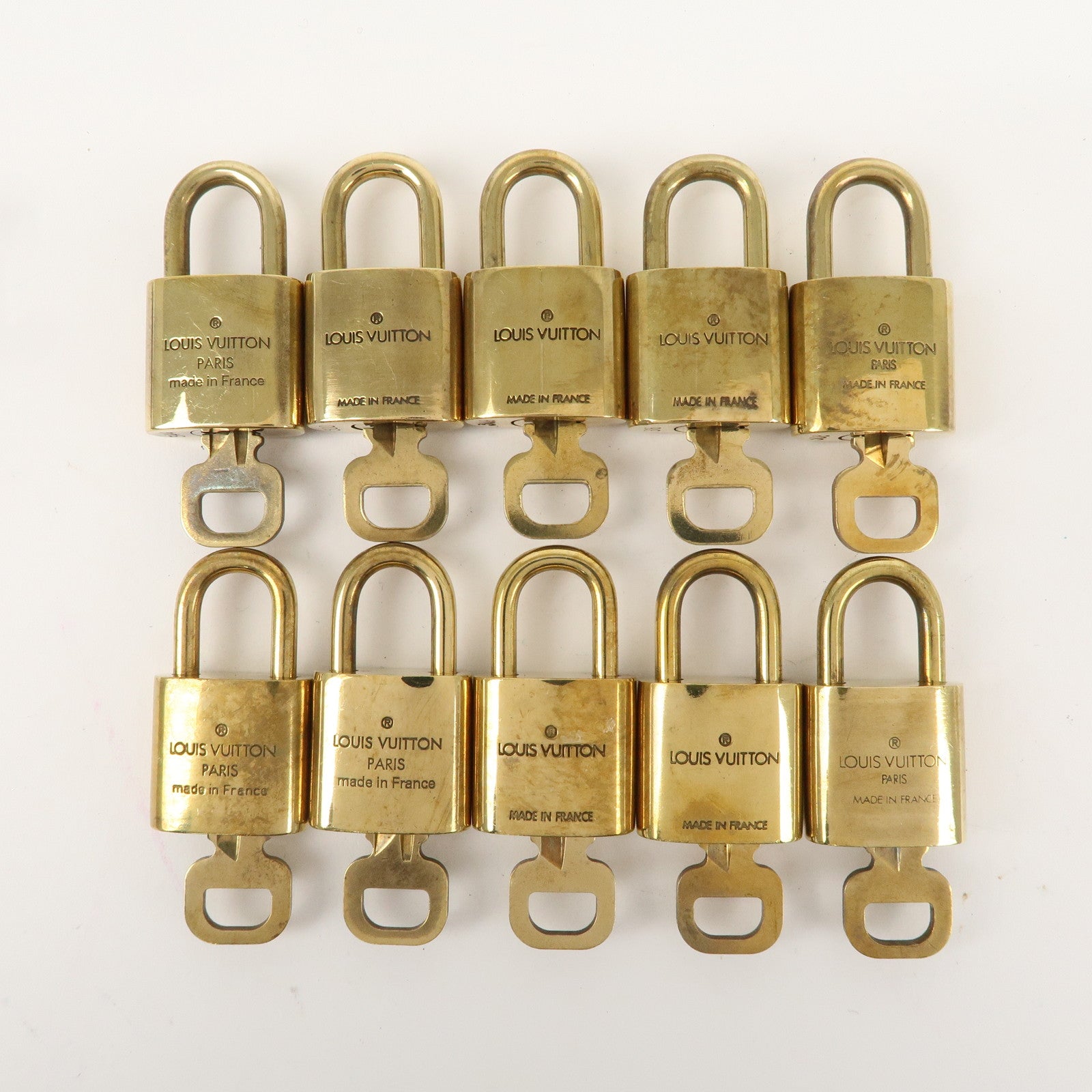 Louis Vuitton Set of 10 Lock 
Key Cadena Key Lock Gold