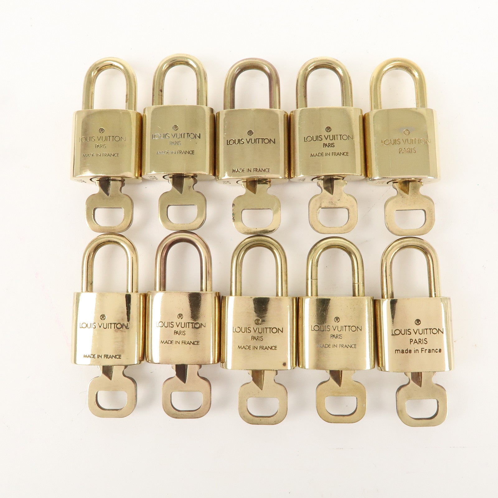 Louis Vuitton Set of 10 Lock 
Key Cadena Key Lock Gold