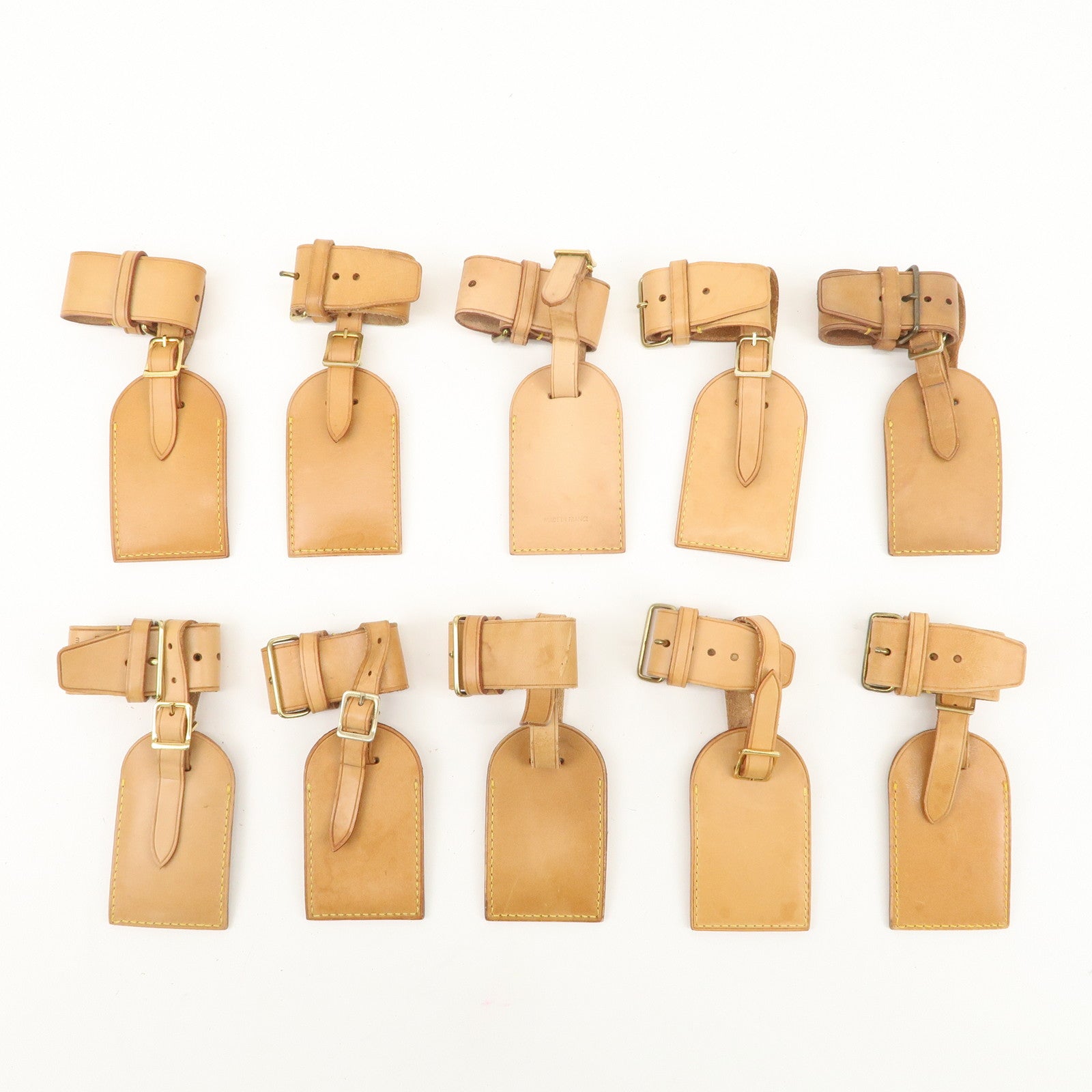 Louis Vuitton Set of 10 Leather Name Tag 
Poignet Natural Used