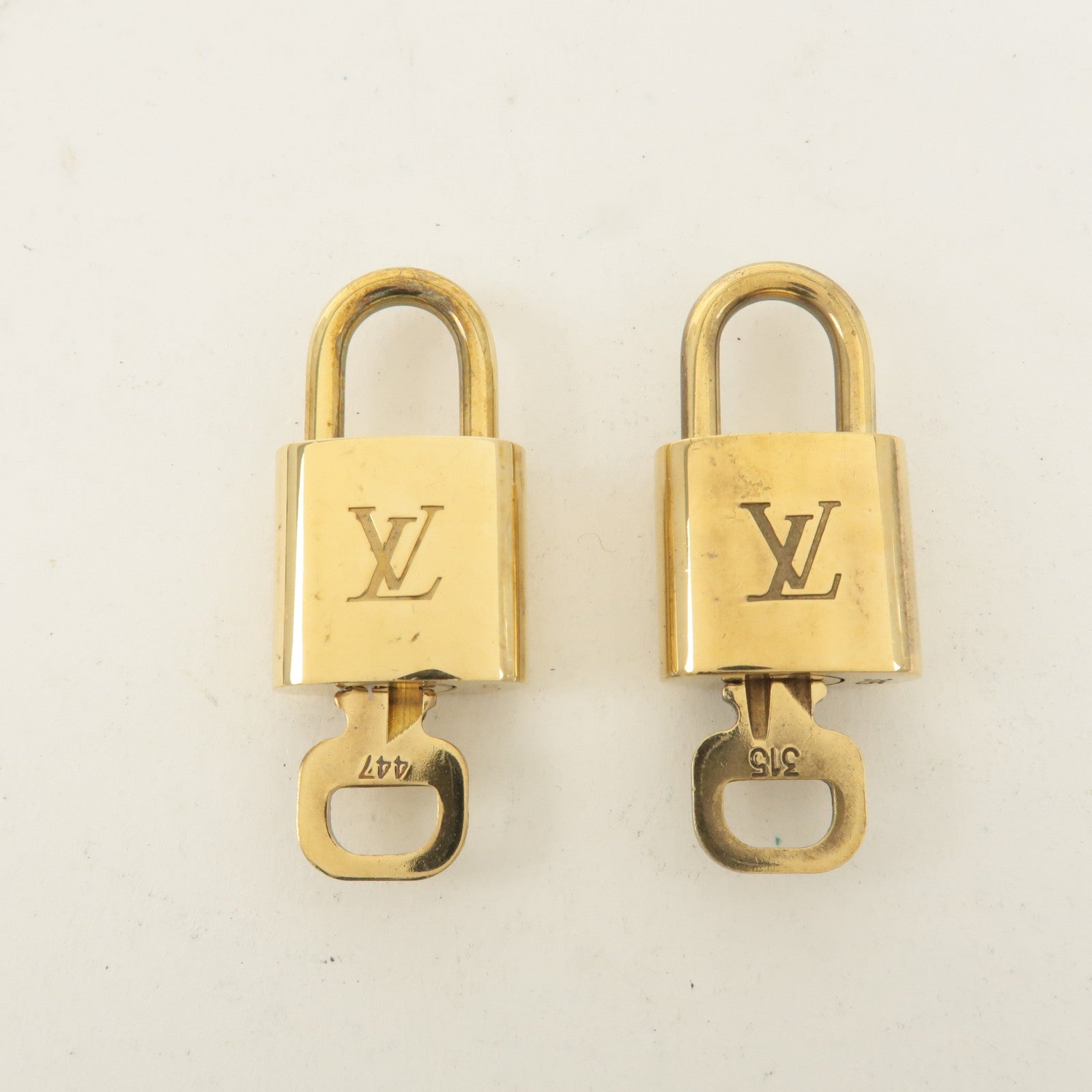 Louis Vuitton Set of 10 Lock 
Key Cadena Key Lock Gold