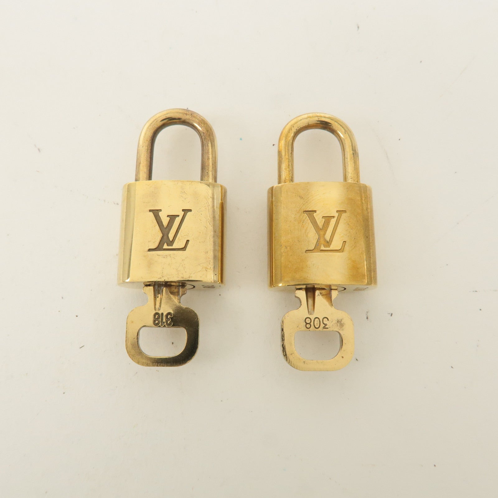 Louis Vuitton Set of 10 Lock 
Key Cadena Key Lock Gold