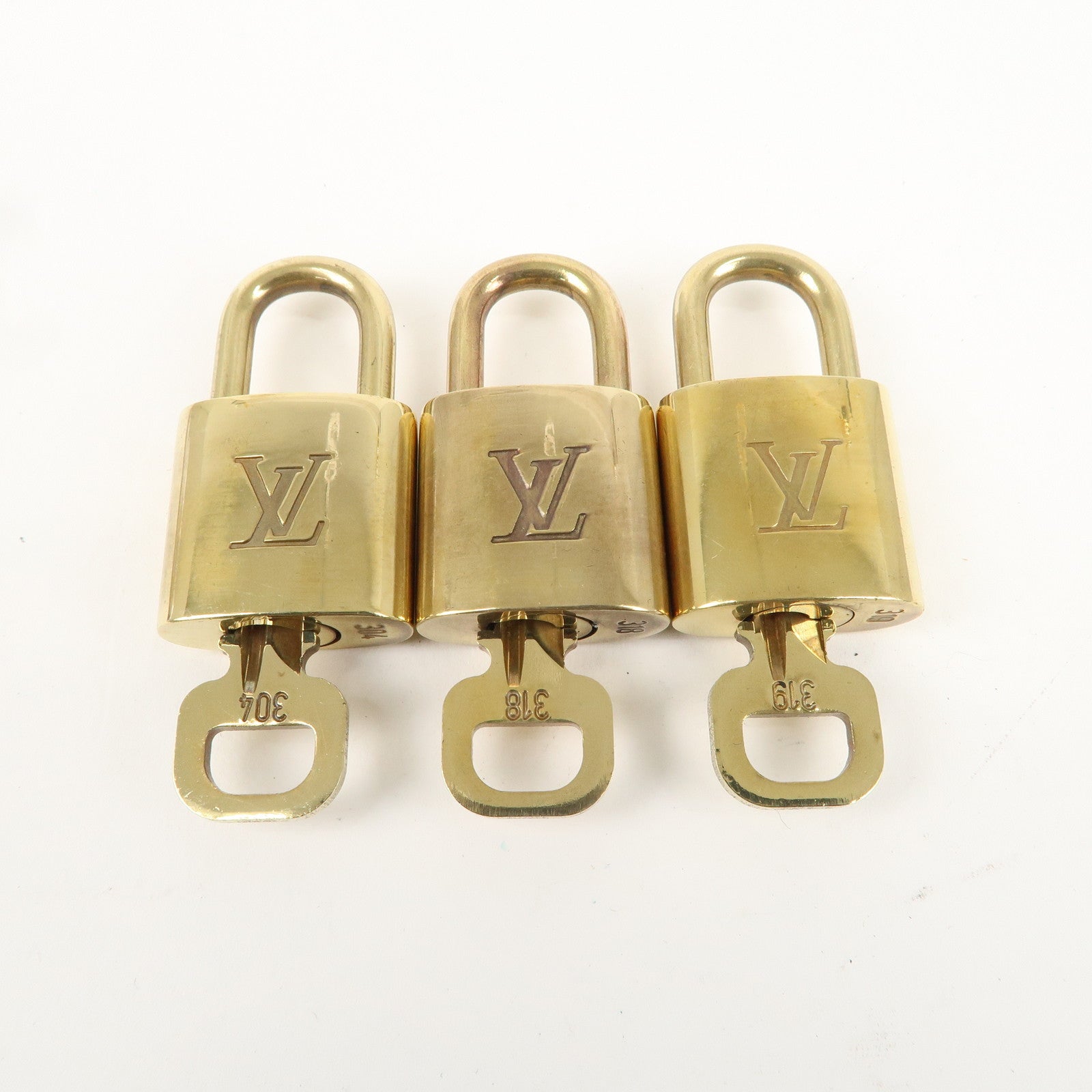 Louis Vuitton Set of 10 Lock 
Key Cadena Key Lock Gold