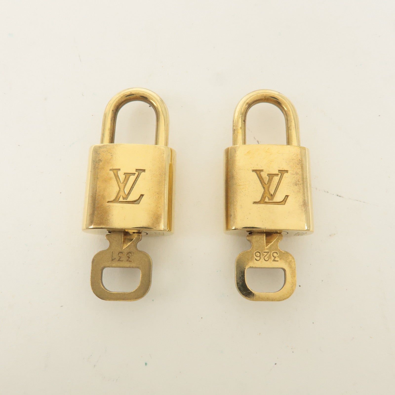 Louis Vuitton Set of 10 Lock 
Key Cadena Key Lock Gold