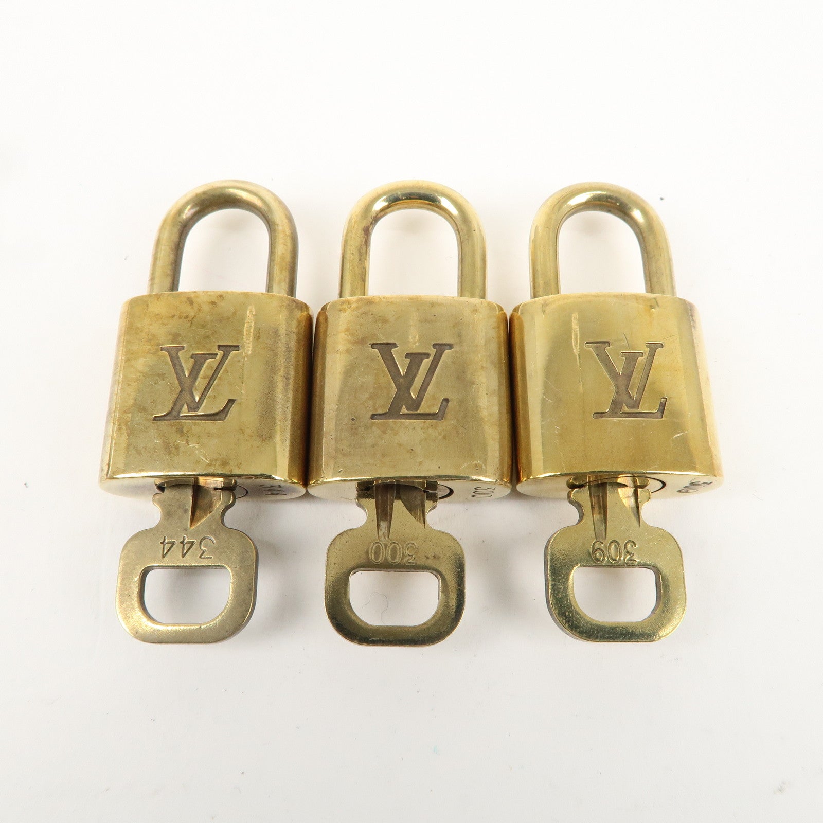 Louis Vuitton Set of 10 Lock 
Key Cadena Key Lock Gold