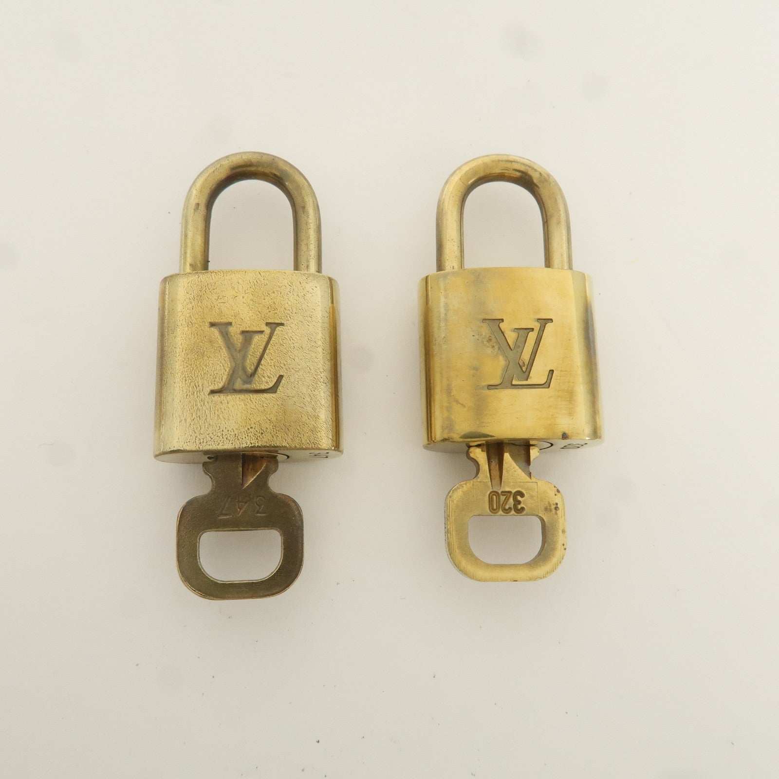 Louis Vuitton Set of 10 Lock 
Key Cadena Key Lock Gold