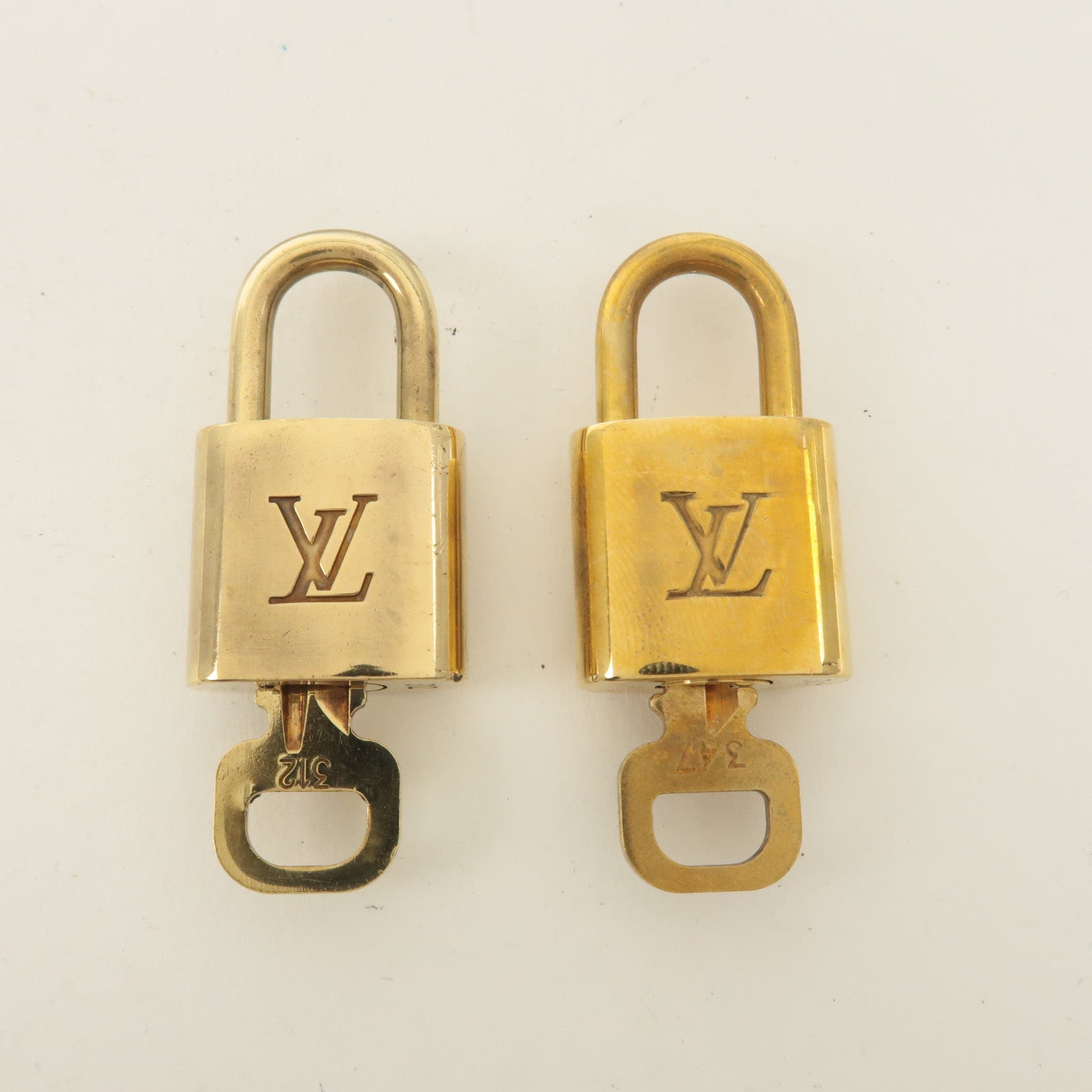 Louis Vuitton Set of 10 Lock 
Key Cadena Key Lock Gold