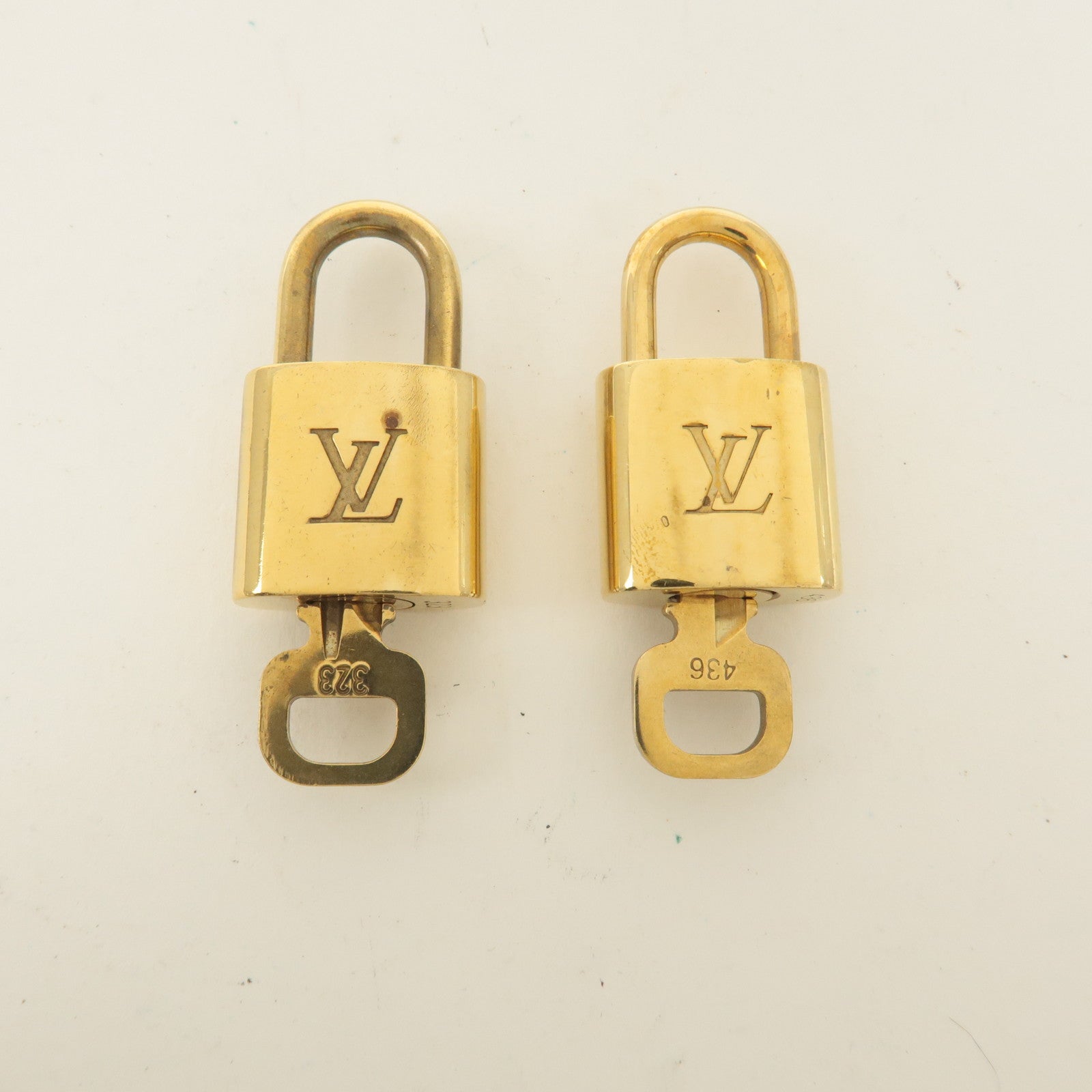 Louis Vuitton Set of 10 Lock 
Key Cadena Key Lock Gold