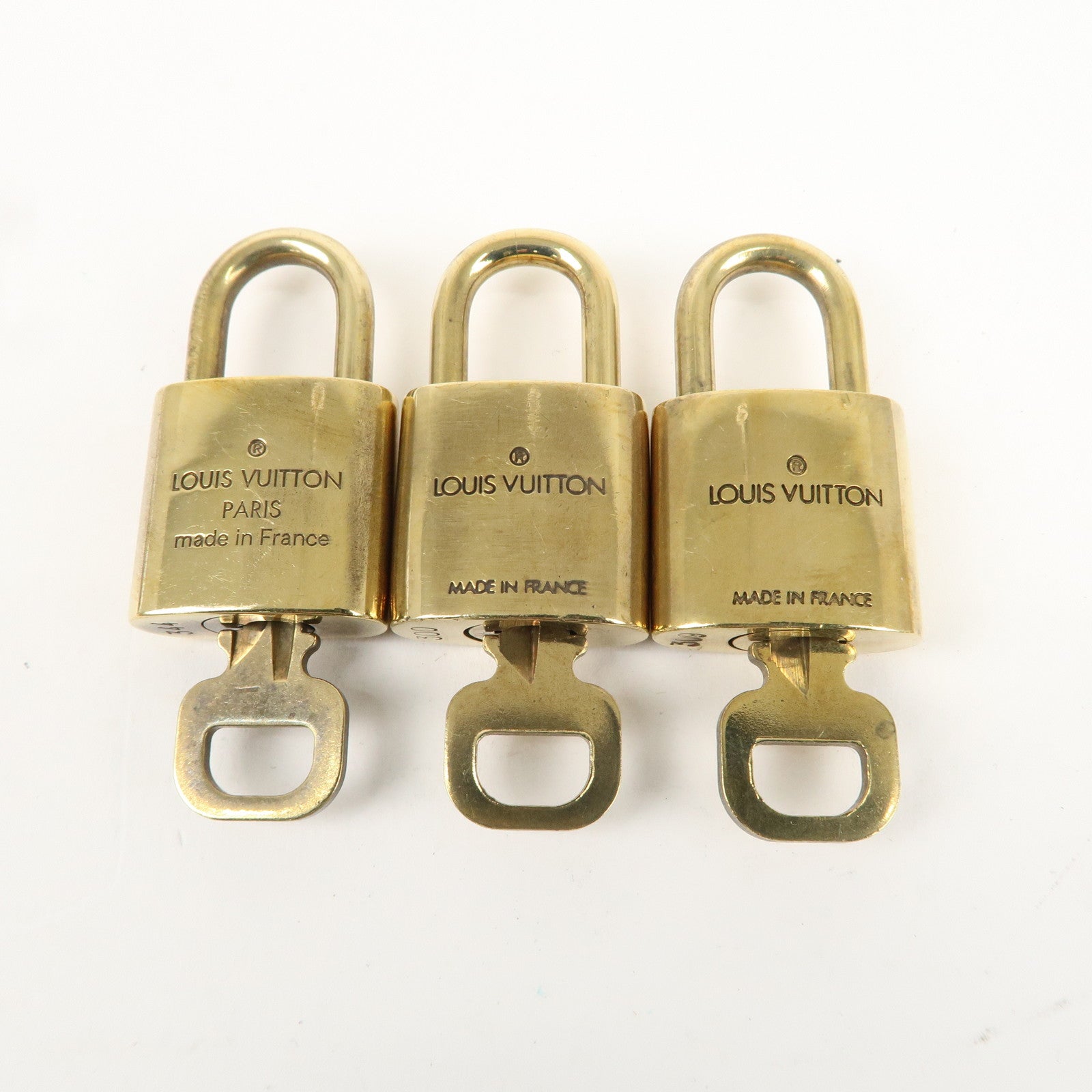 Louis Vuitton Set of 10 Lock 
Key Cadena Key Lock Gold