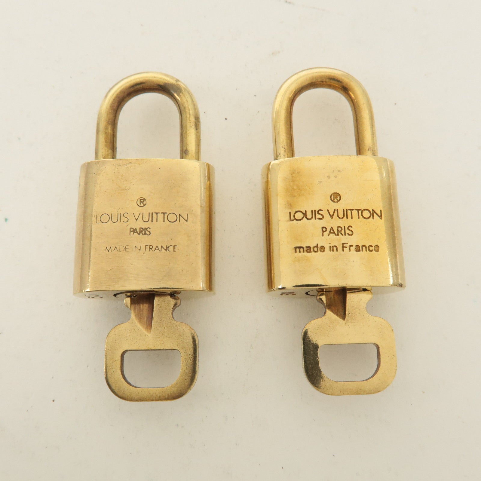 Louis Vuitton Set of 10 Lock 
Key Cadena Key Lock Gold