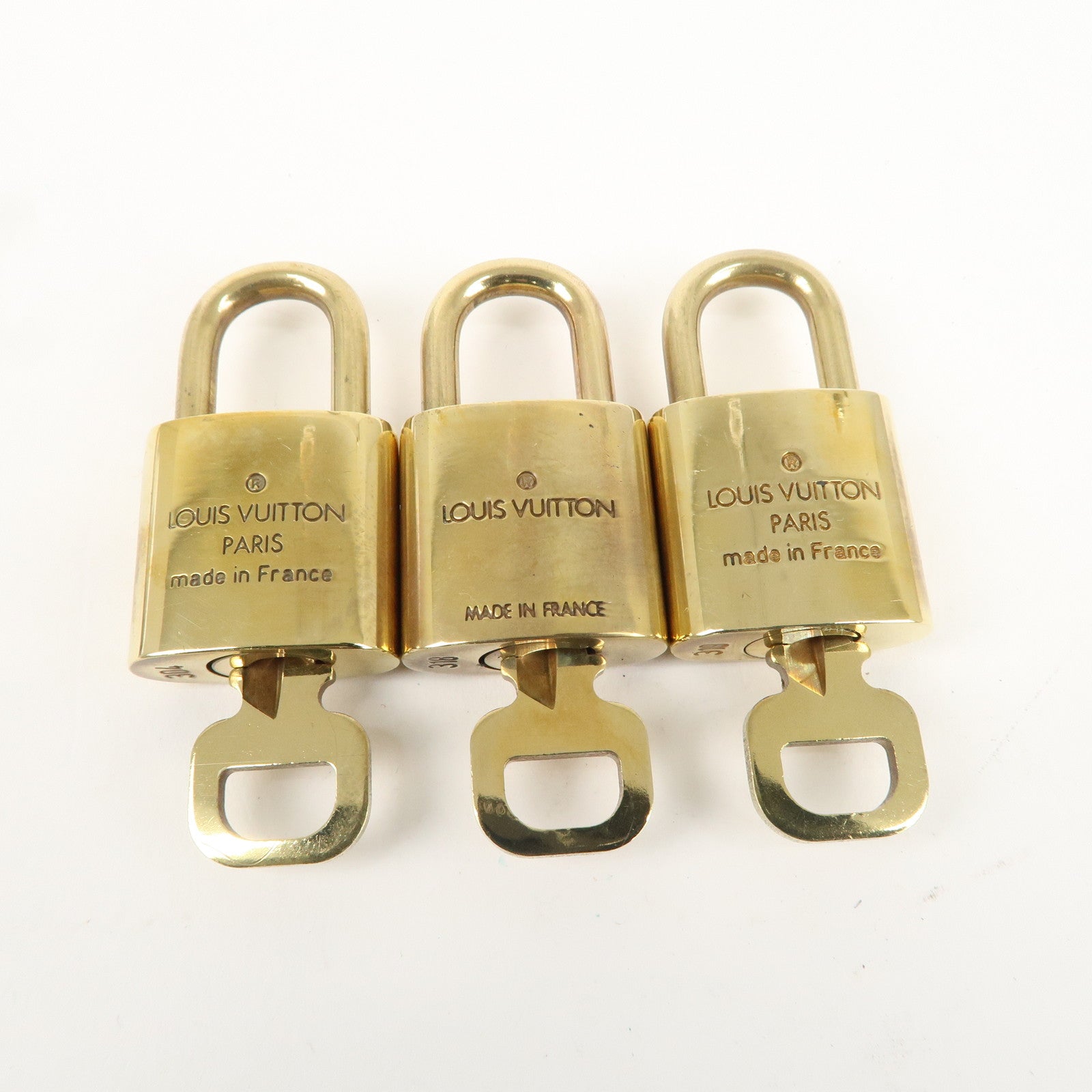 Louis Vuitton Set of 10 Lock 
Key Cadena Key Lock Gold