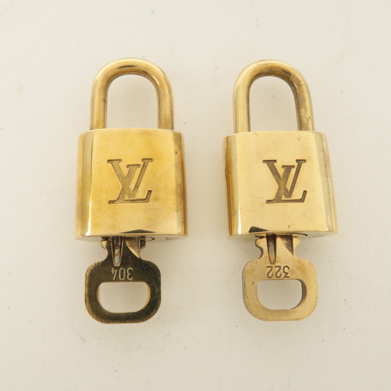 Louis Vuitton Set of 10 Lock 
Key Cadena Key Lock Gold