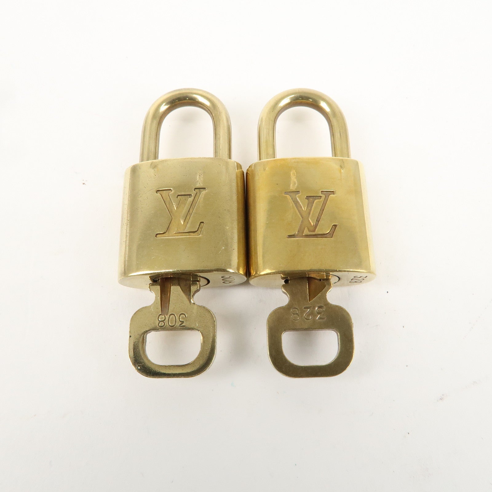 Louis Vuitton Set of 10 Lock 
Key Cadena Key Lock Gold