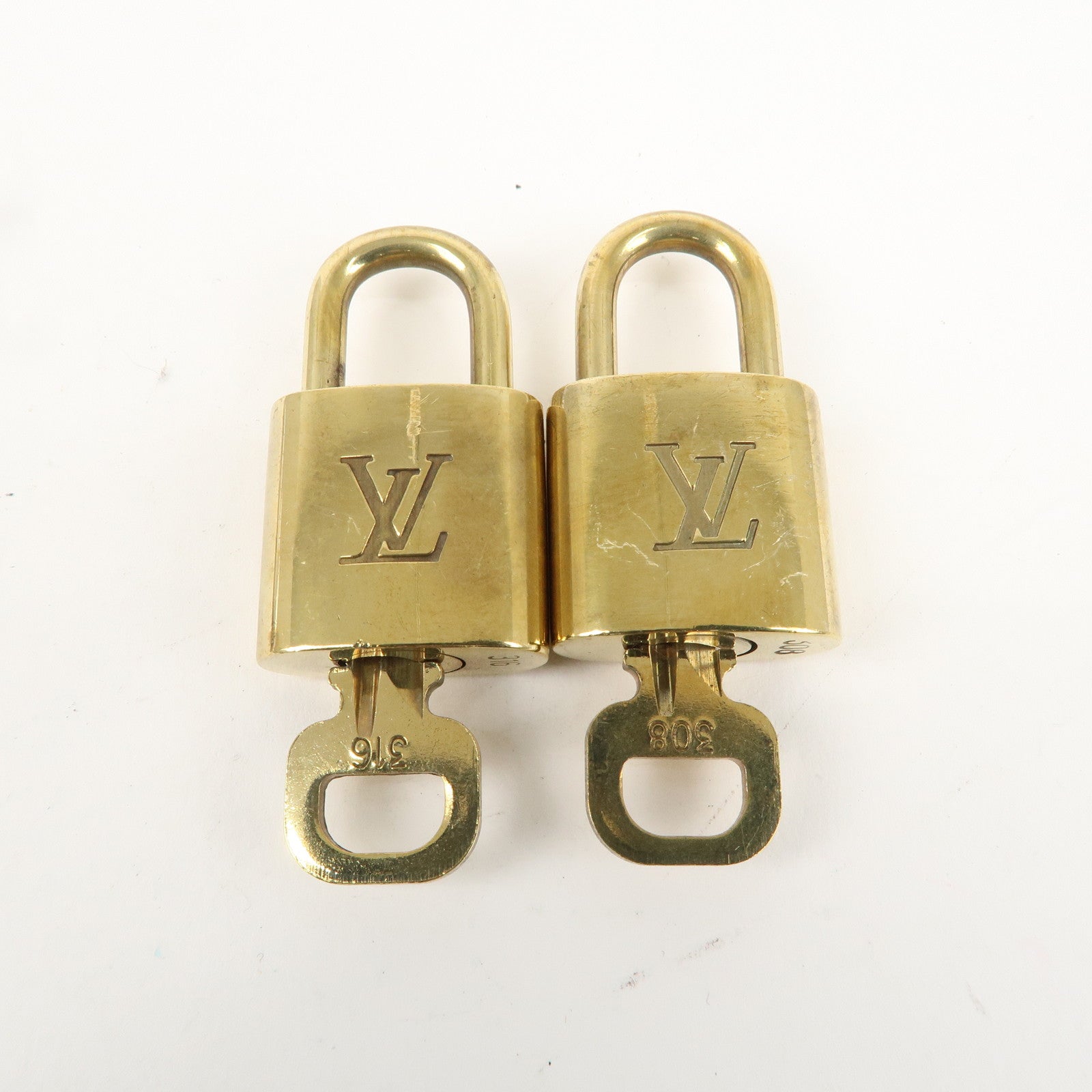 Louis Vuitton Set of 10 Lock 
Key Cadena Key Lock Gold