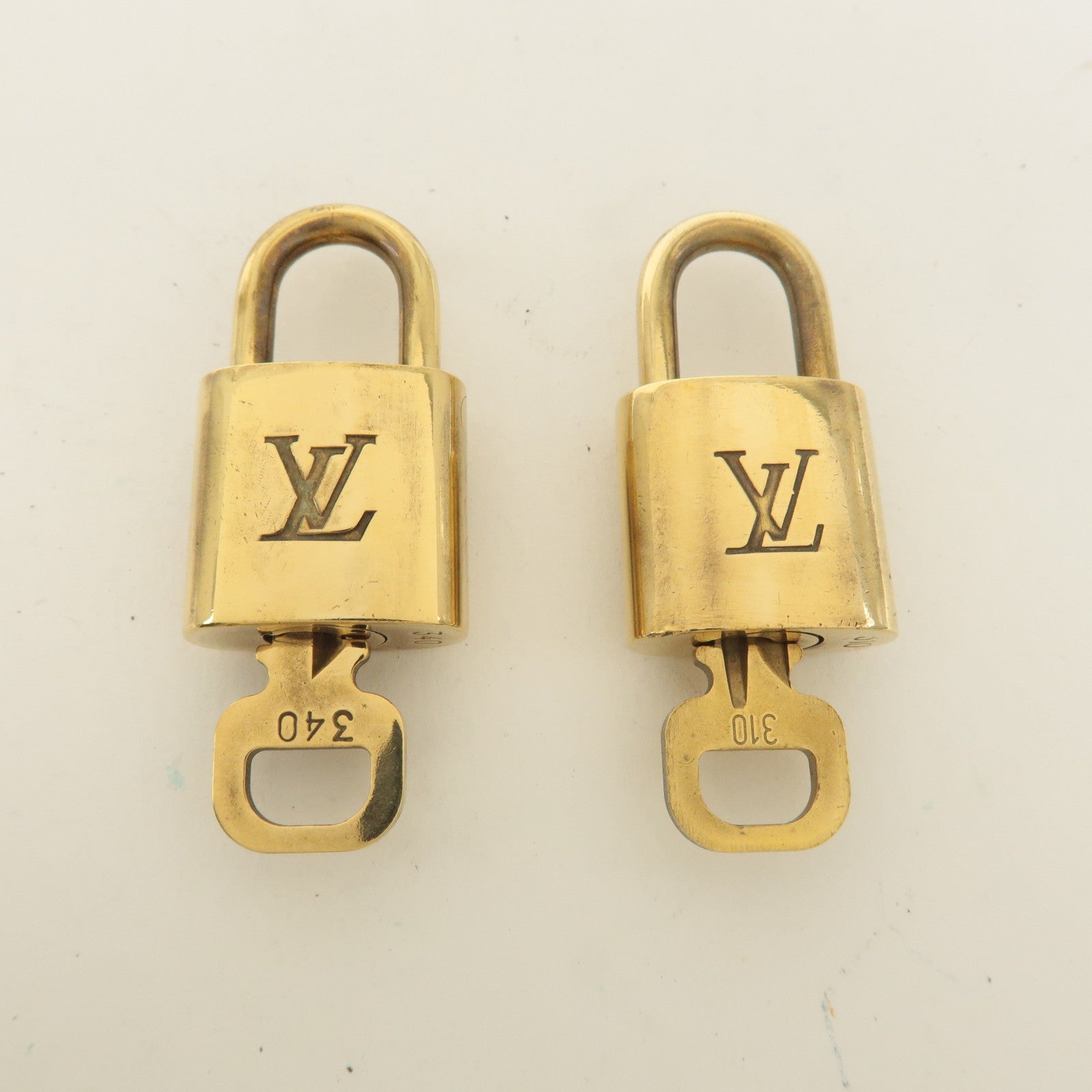 Louis Vuitton Set of 10 Lock 
Key Cadena Key Lock Gold