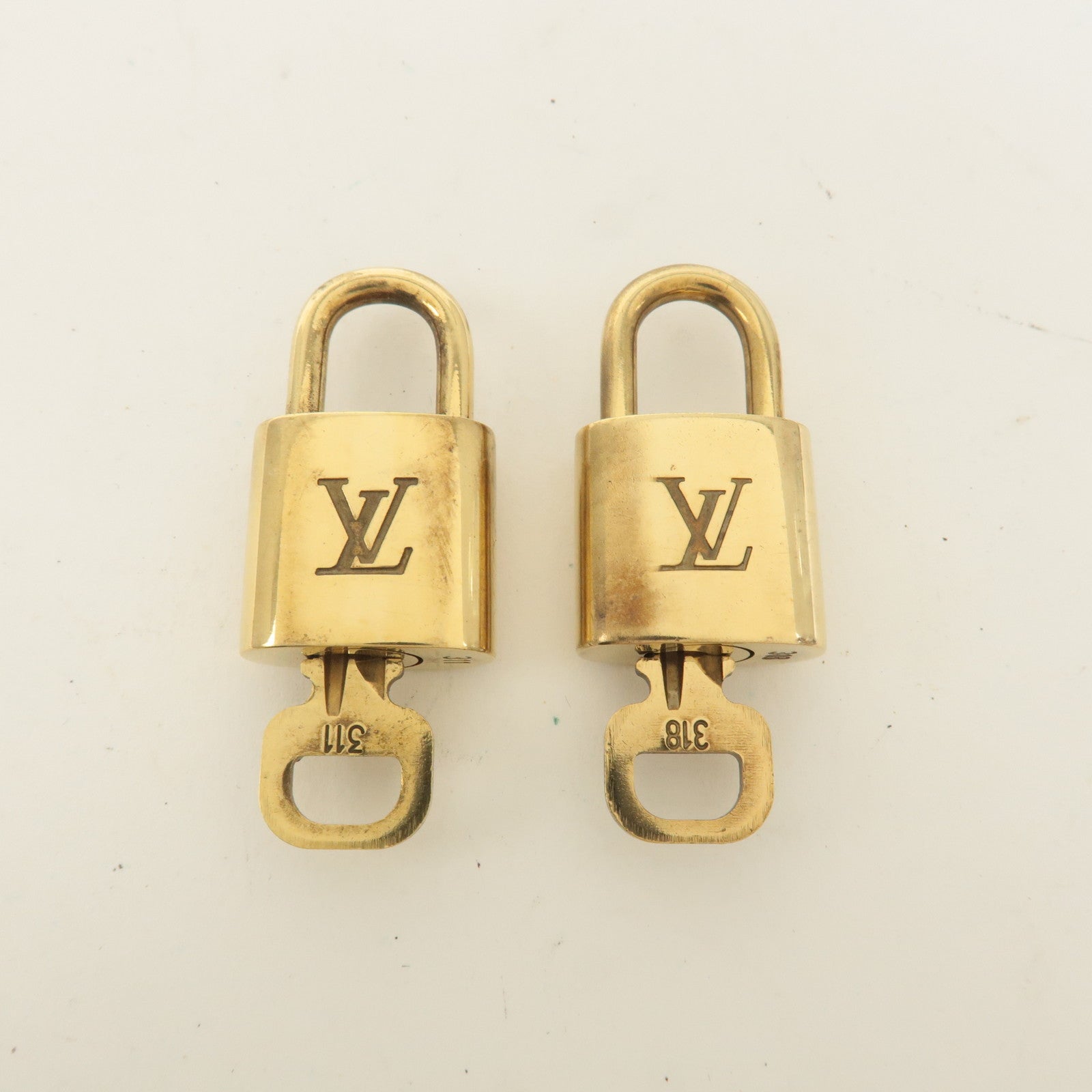 Louis Vuitton Set of 10 Lock 
Key Cadena Key Lock Gold