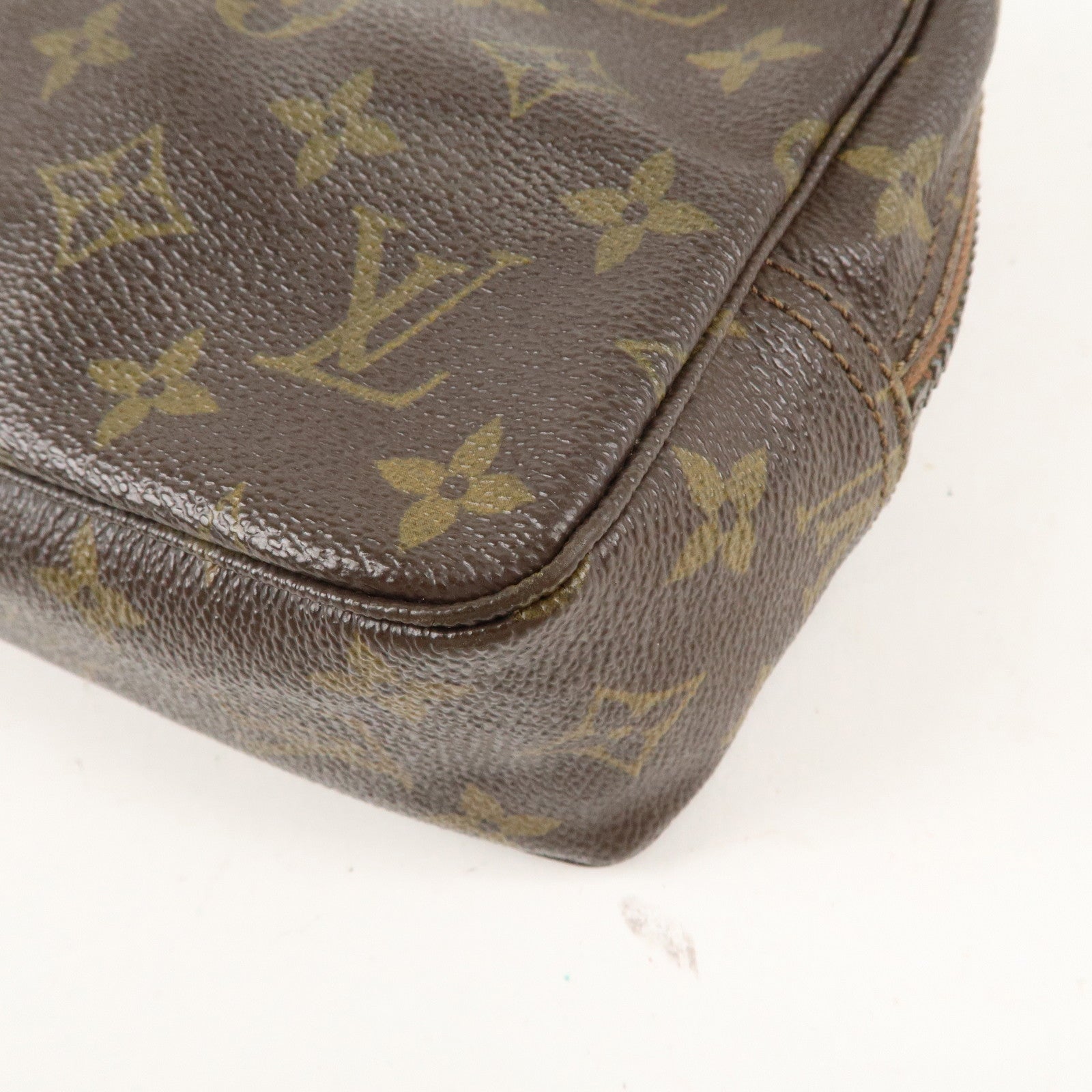 is Vuitton Monogram Trousse Toilette 23 Cosmetic Pouch M47524