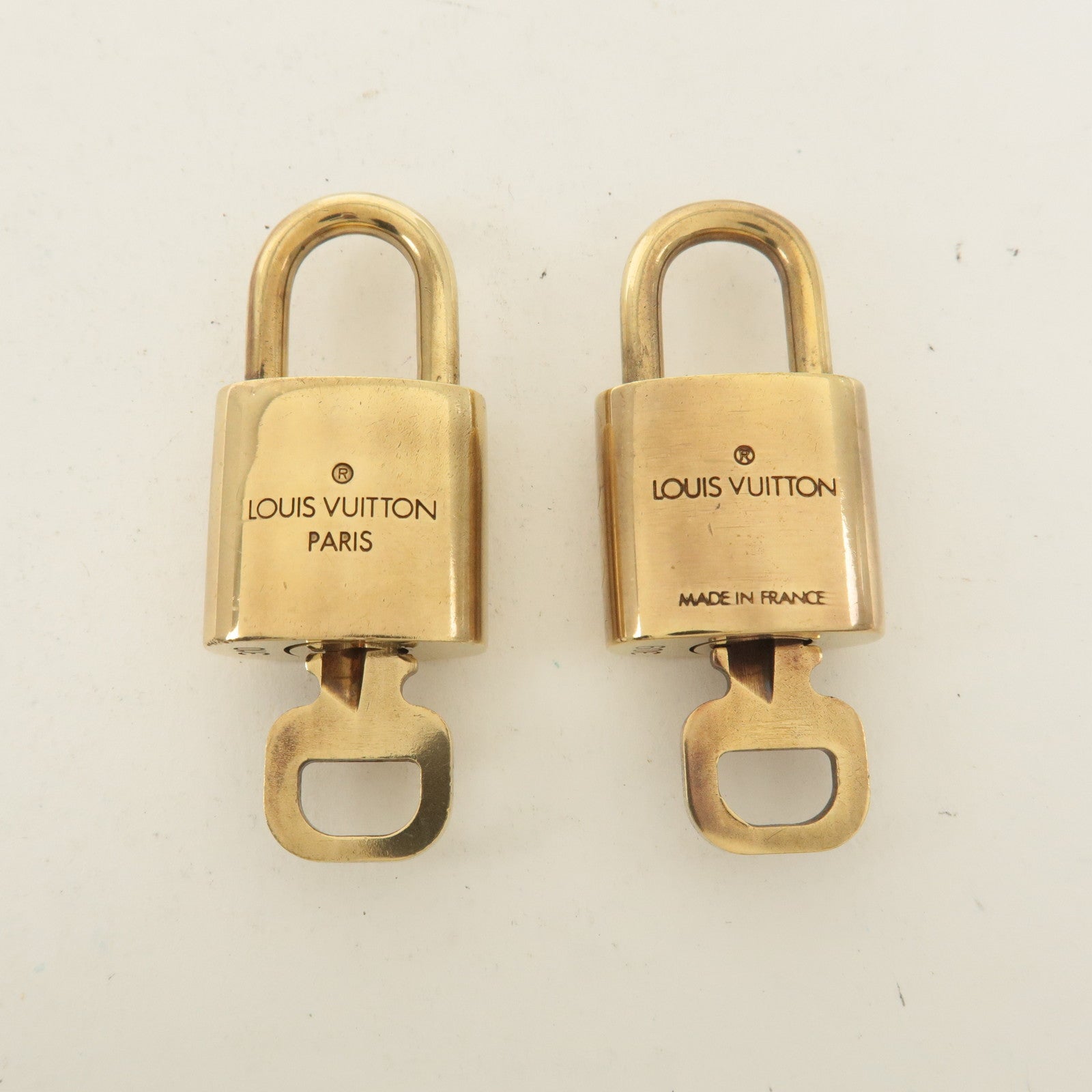 Louis Vuitton Set of 10 Lock 
Key Cadena Key Lock Gold