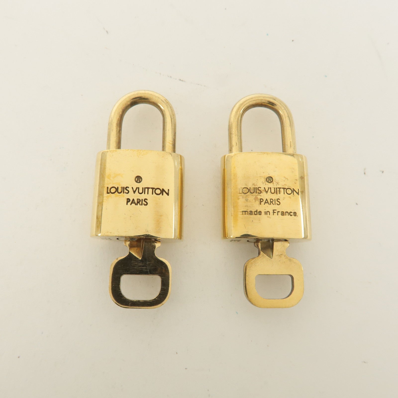 Louis Vuitton Set of 10 Lock 
Key Cadena Key Lock Gold