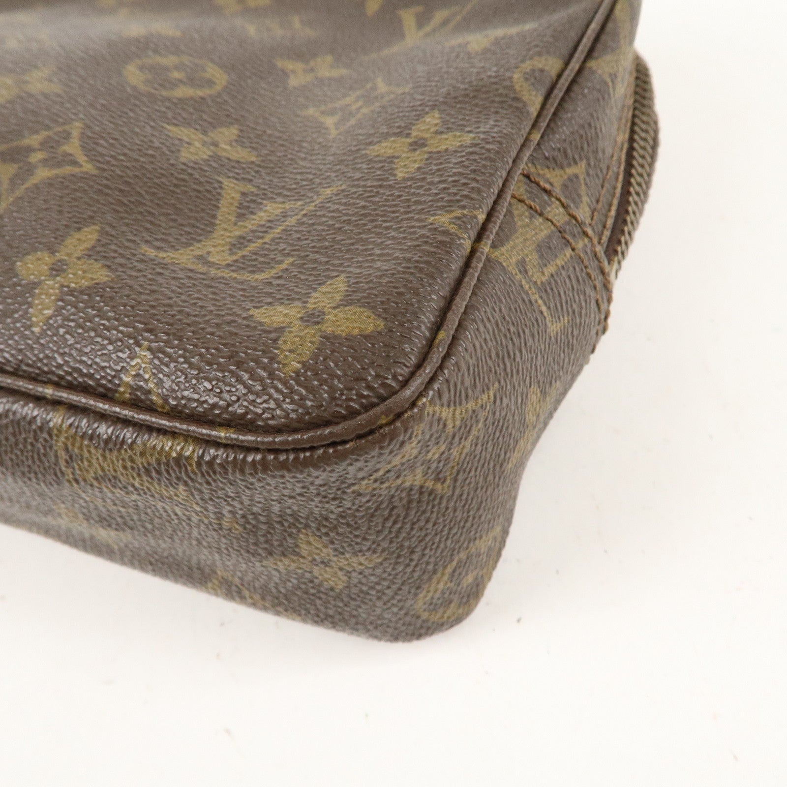 is Vuitton Monogram Trousse Toilette 23 Cosmetic Pouch M47524