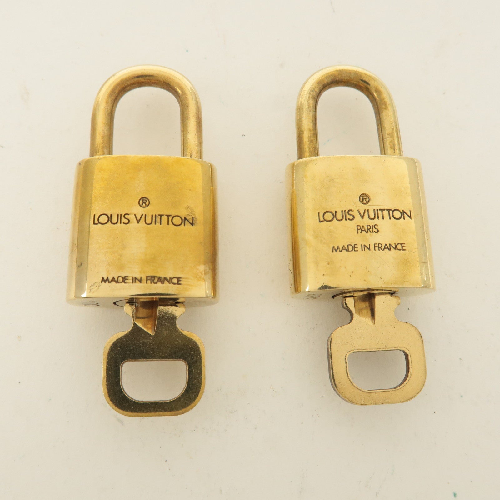 Louis Vuitton Set of 10 Lock 
Key Cadena Key Lock Gold