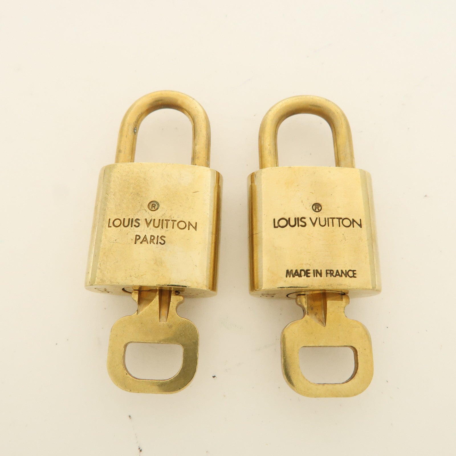 Louis Vuitton Set of 10 Lock 
Key Cadena Key Lock Used