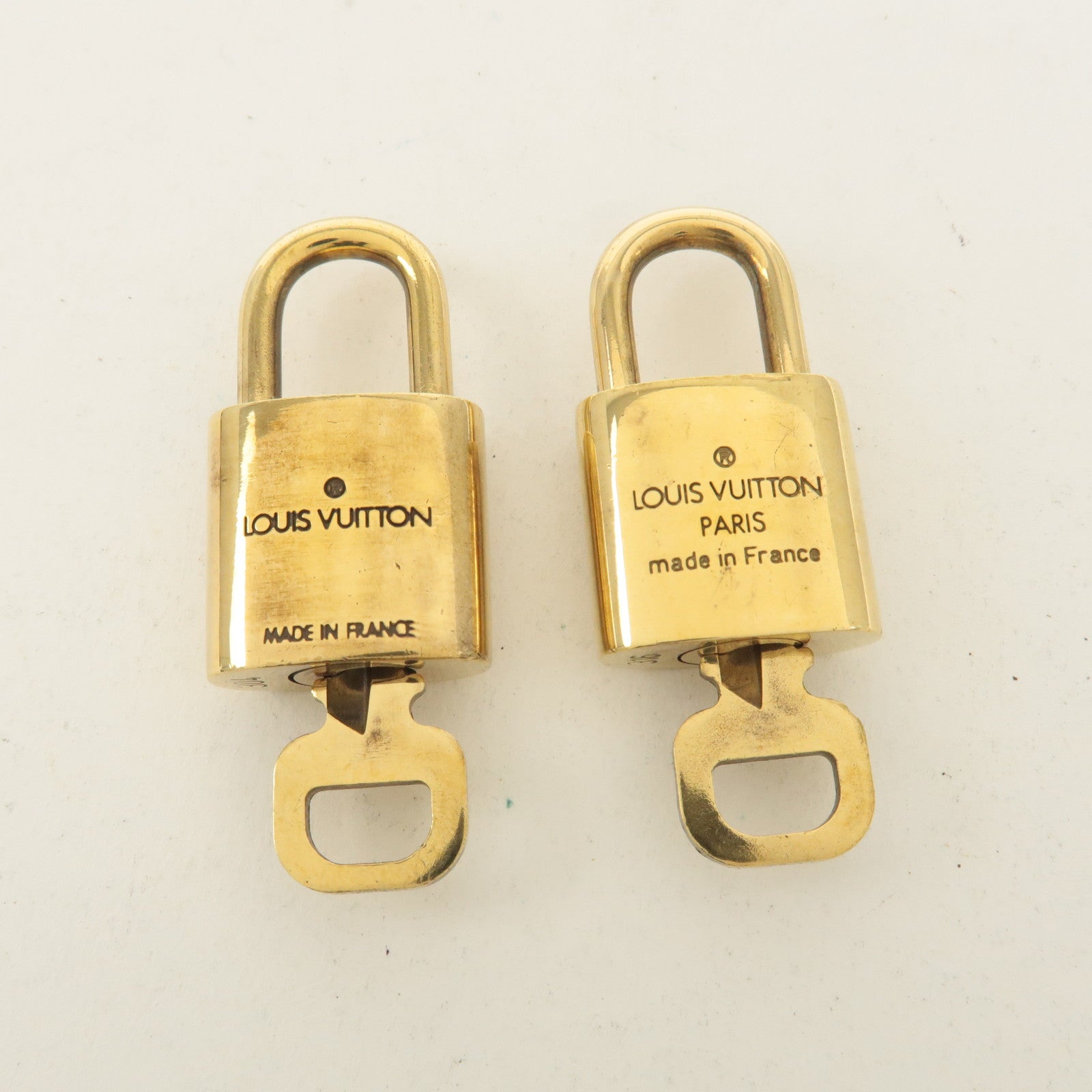 Louis Vuitton Set of 10 Lock 
Key Cadena Key Lock Gold