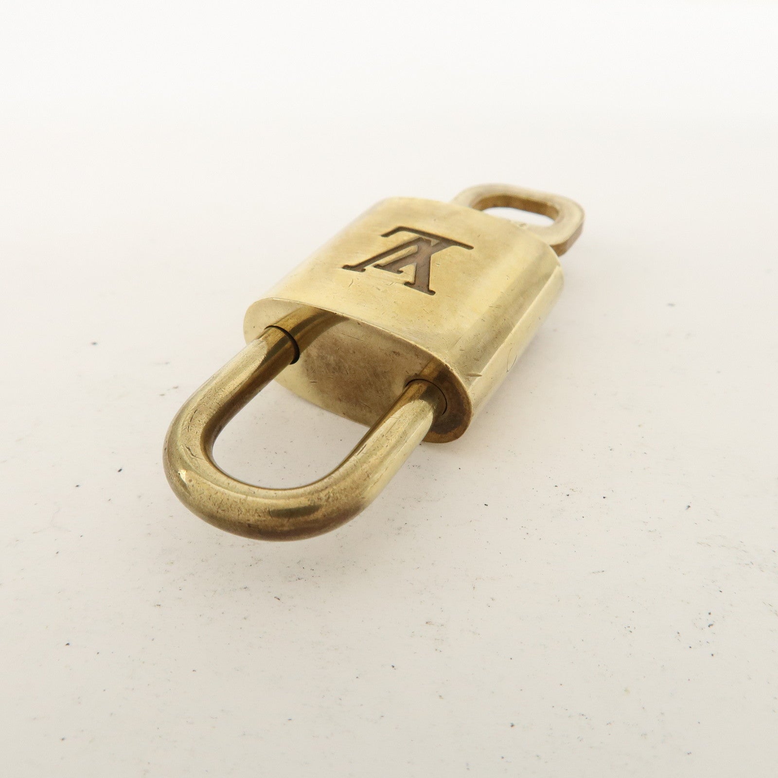 Louis Vuitton Set of 10 Lock 
Key Cadena Key Lock Metal Gold