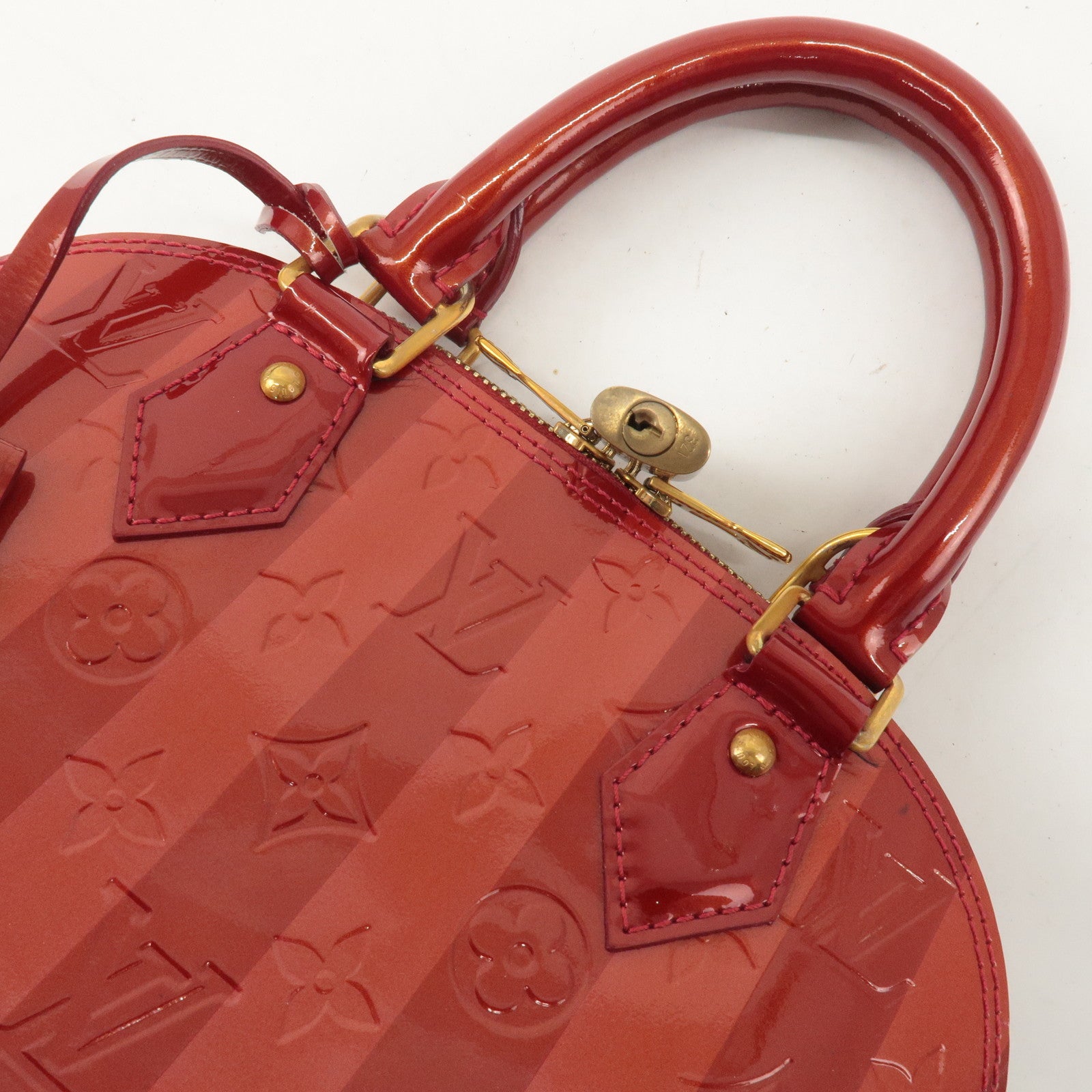 Louis Vuitton Monogram Vernis Rayures Alma BB Pomme d
Arour M91593