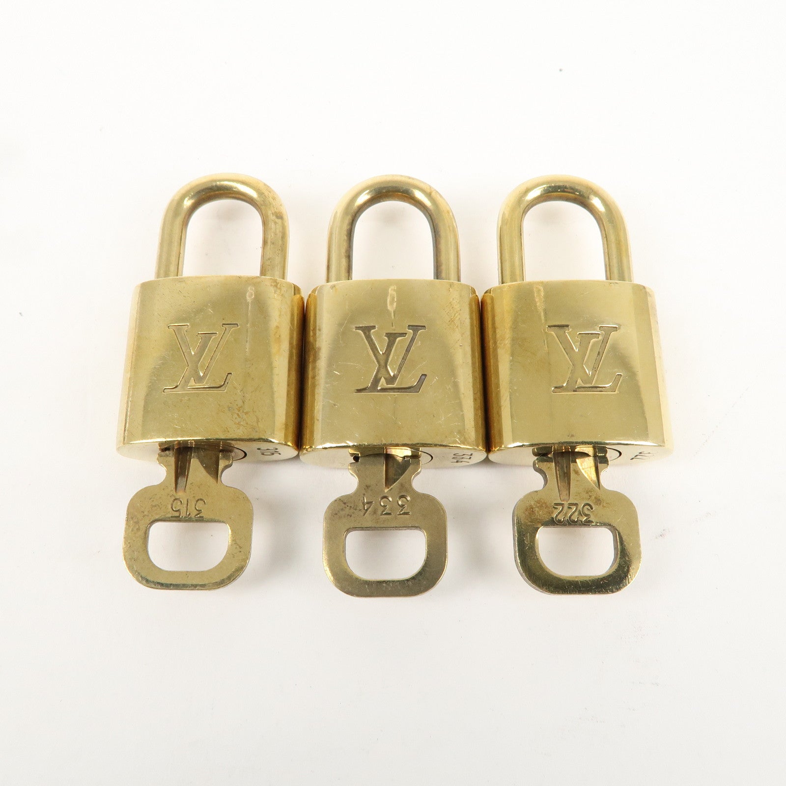 Louis Vuitton Set of 10 Lock 
Key Cadena Key Lock Gold