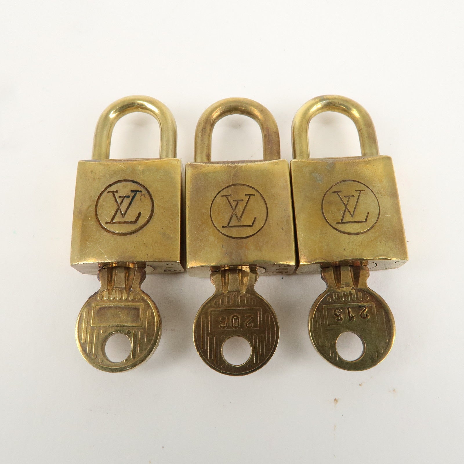 Louis Vuitton Set of 10 Lock 
Key Cadena Key Lock Gold