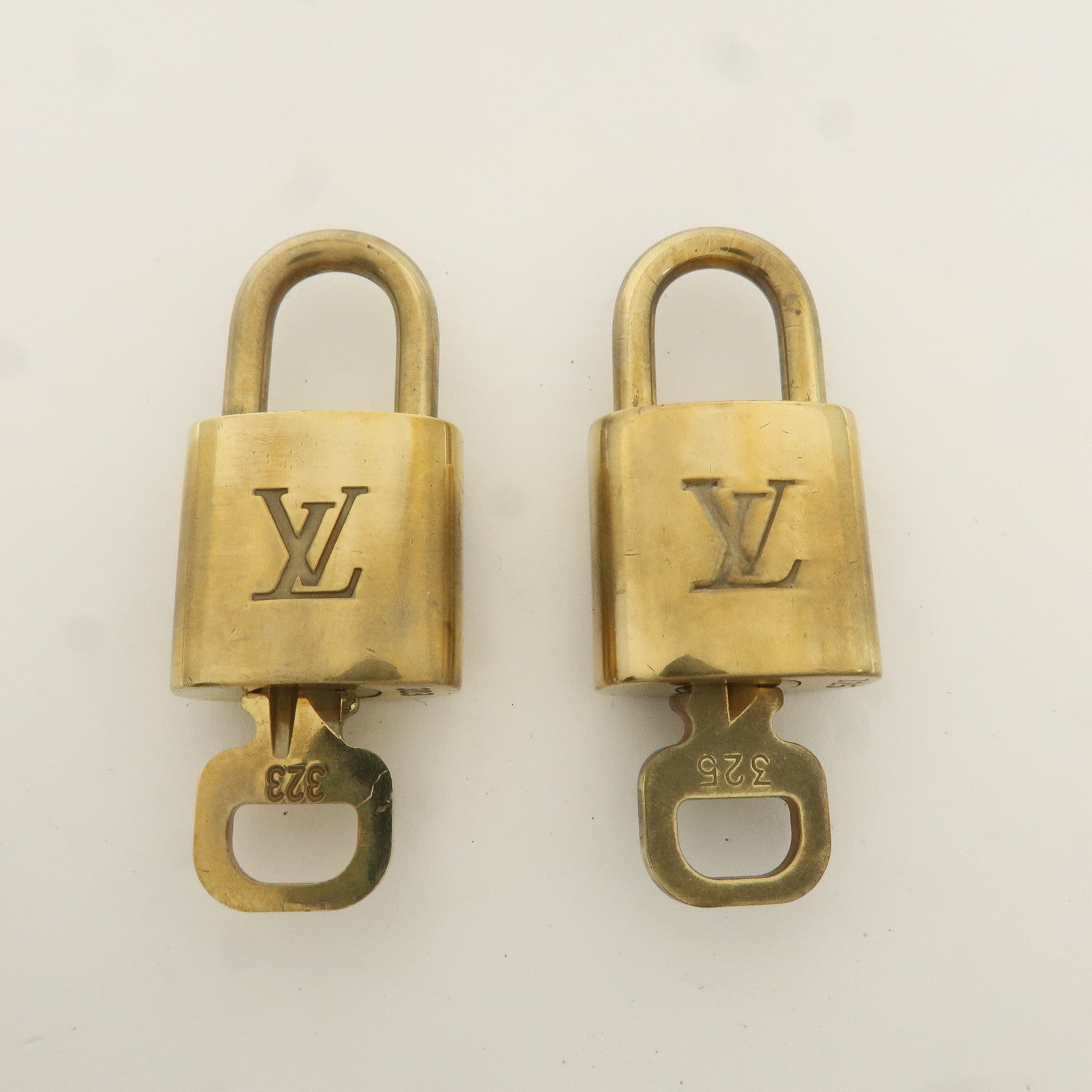 Louis Vuitton Set of 10 Lock 
Key Cadena Key Lock Gold