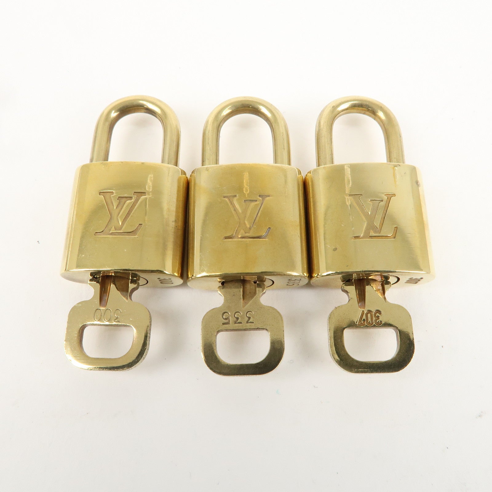 Louis Vuitton Set of 10 Lock 
Key Cadena Key Lock Gold