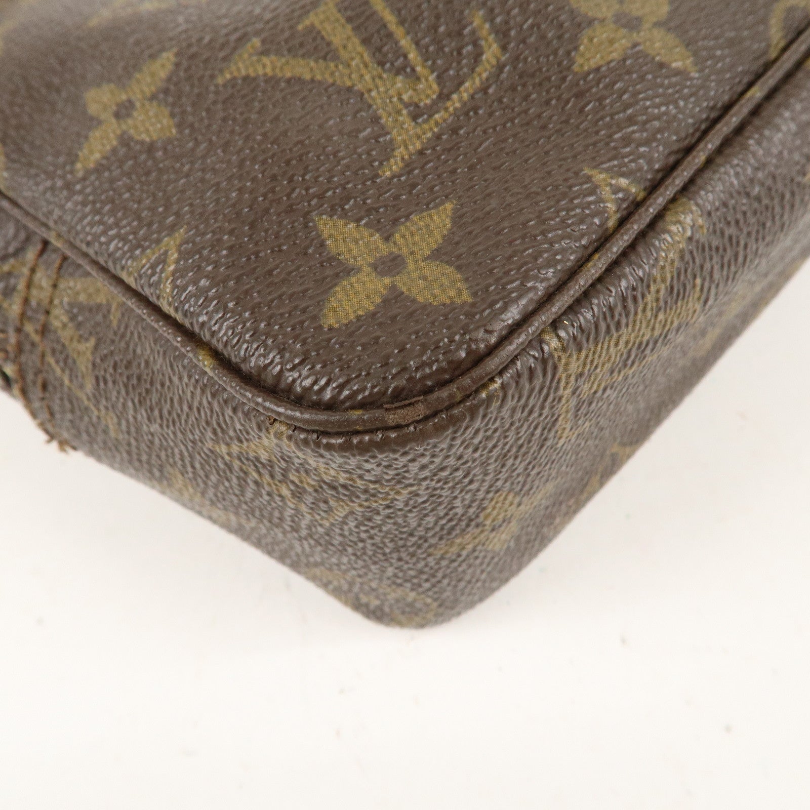 is Vuitton Monogram Trousse Toilette 23 Cosmetic Pouch M47524