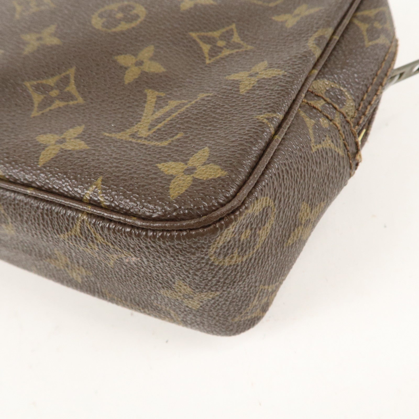 is Vuitton Monogram Trousse Toilette 23 Cosmetic Pouch M47524