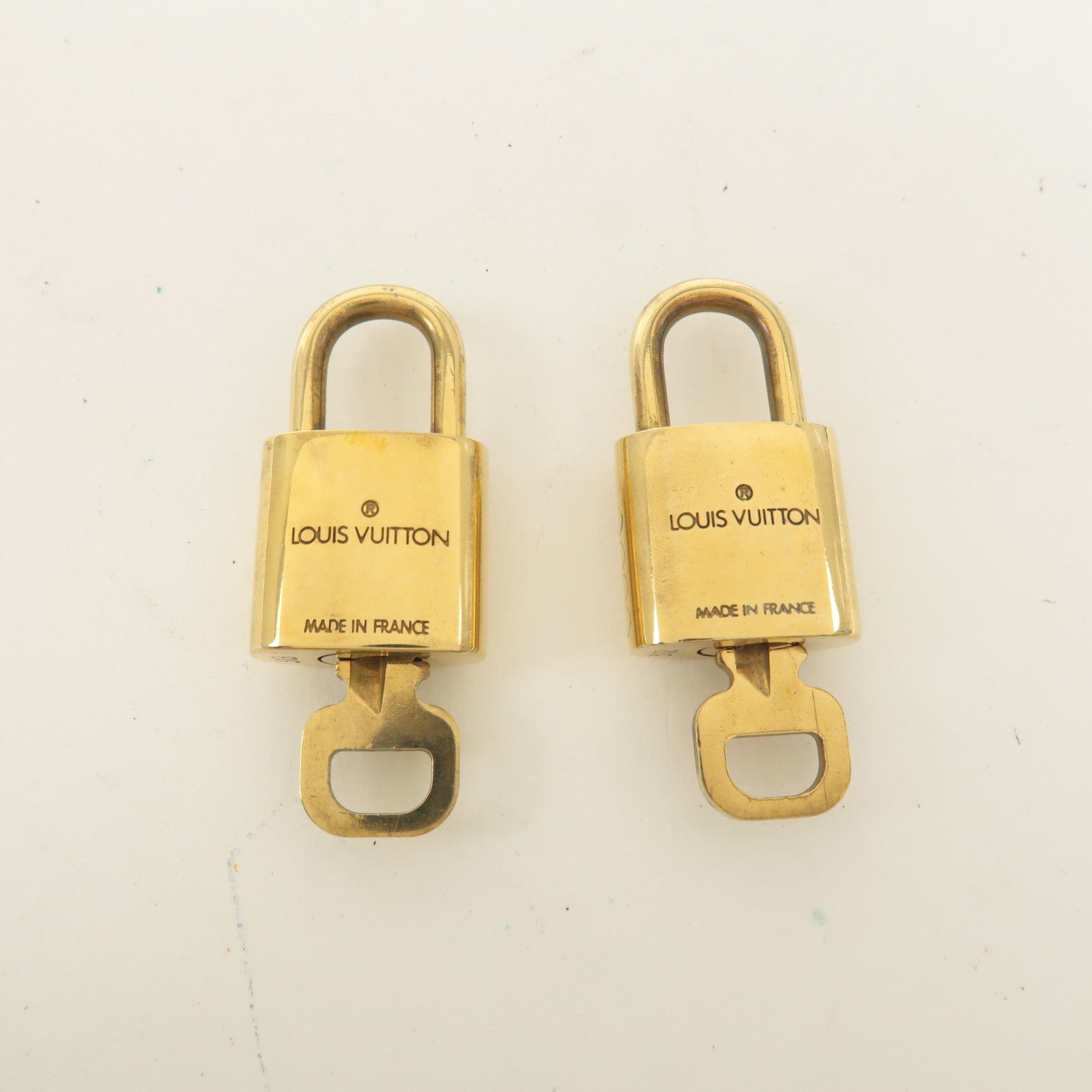 Louis Vuitton Set of 10 Lock 
Key Cadena Key Lock Gold