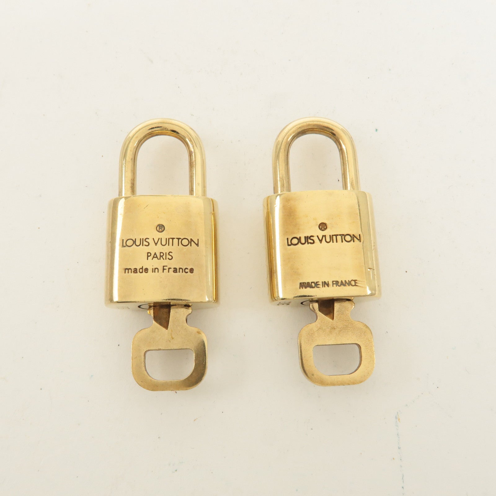 Louis Vuitton Set of 10 Lock 
Key Cadena Key Lock Gold