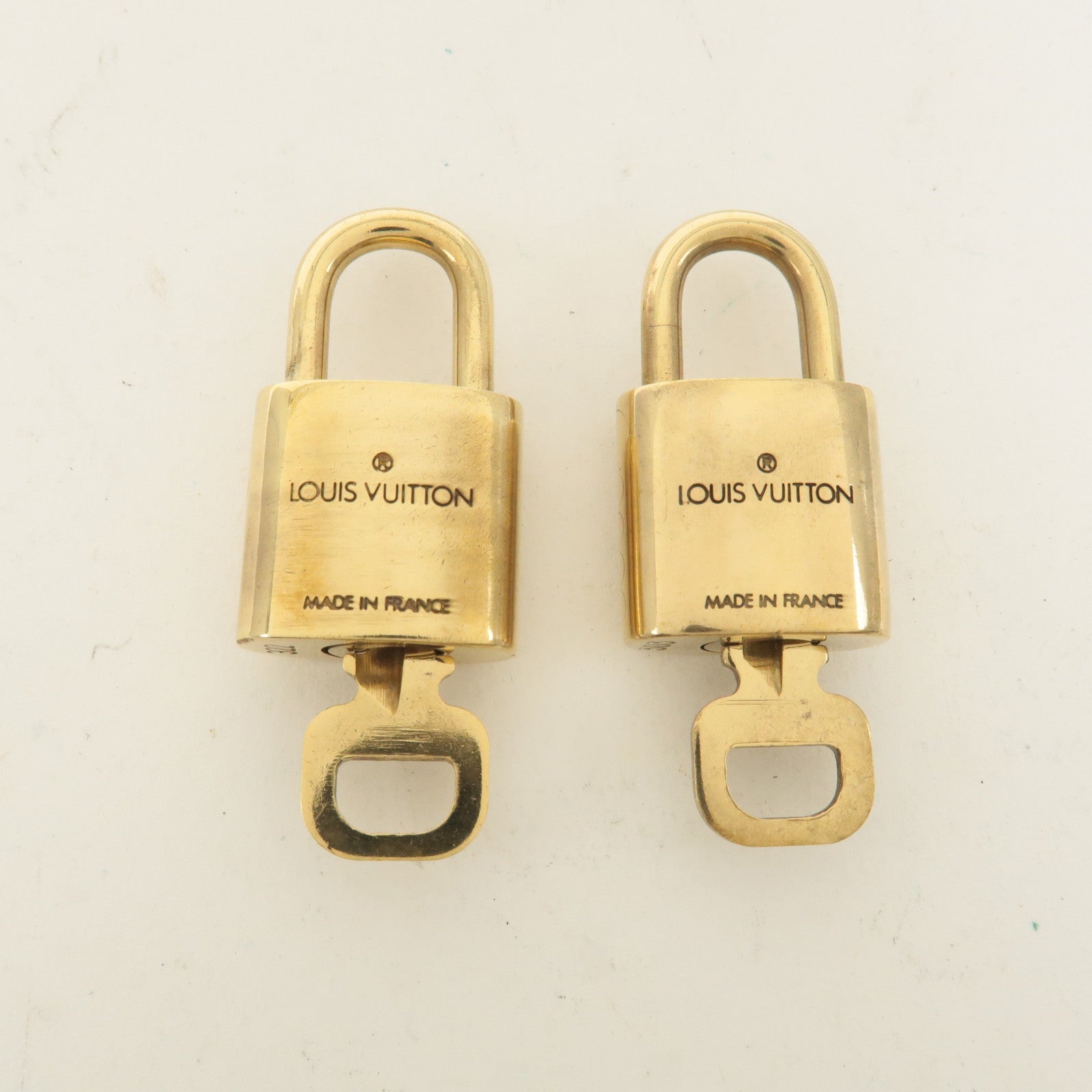 Louis Vuitton Set of 10 Lock 
Key Cadena Key Lock Gold