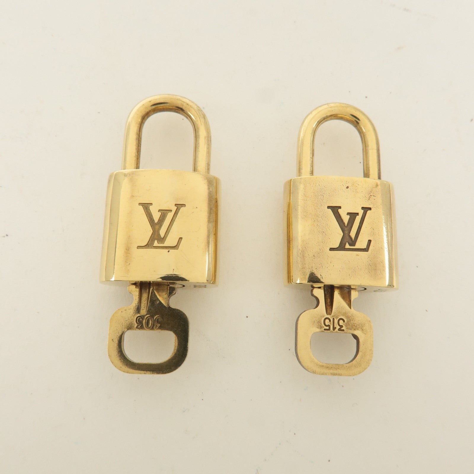 Louis Vuitton Set of 10 Lock 
Key Cadena Key Lock Gold