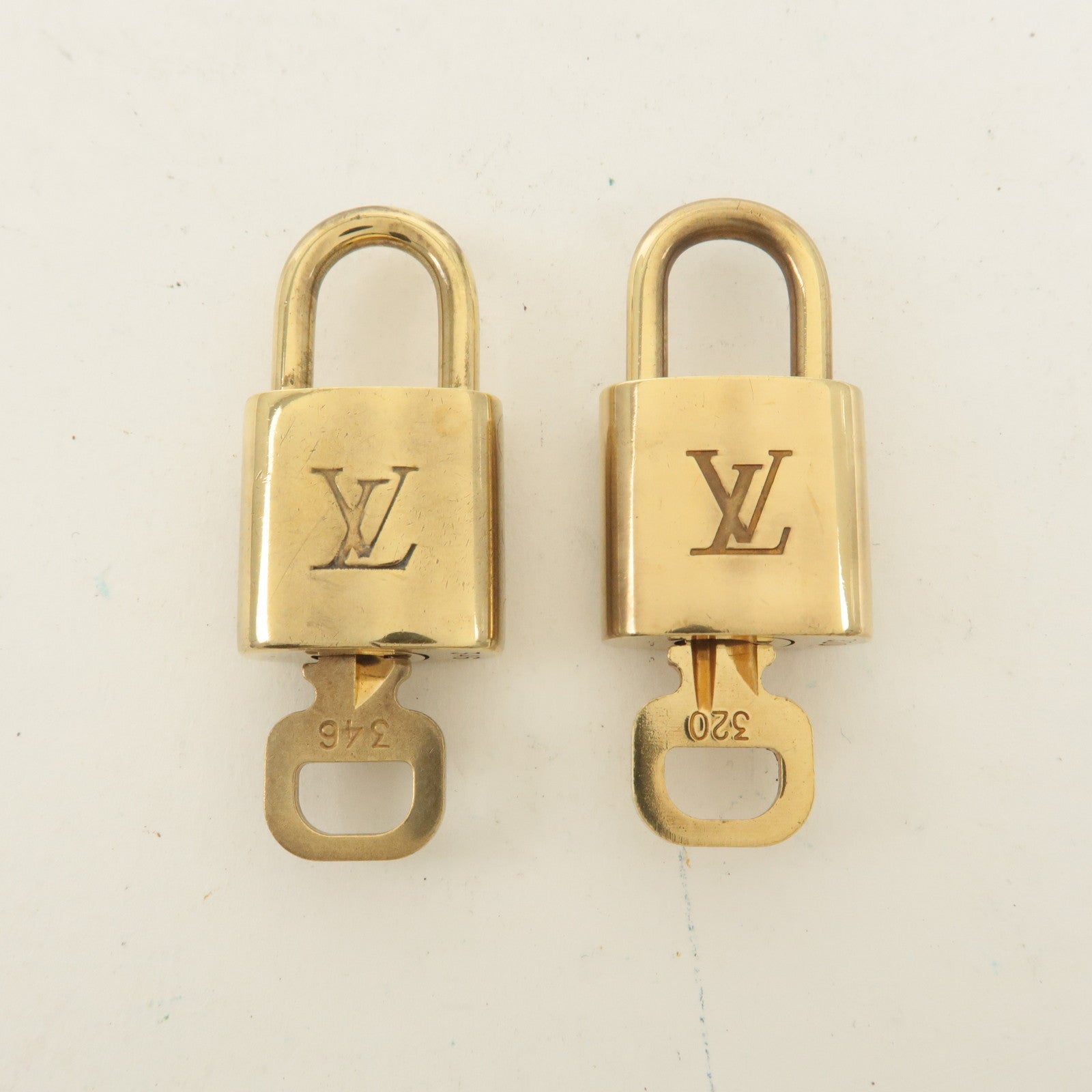 Louis Vuitton Set of 10 Lock 
Key Cadena Key Lock Gold